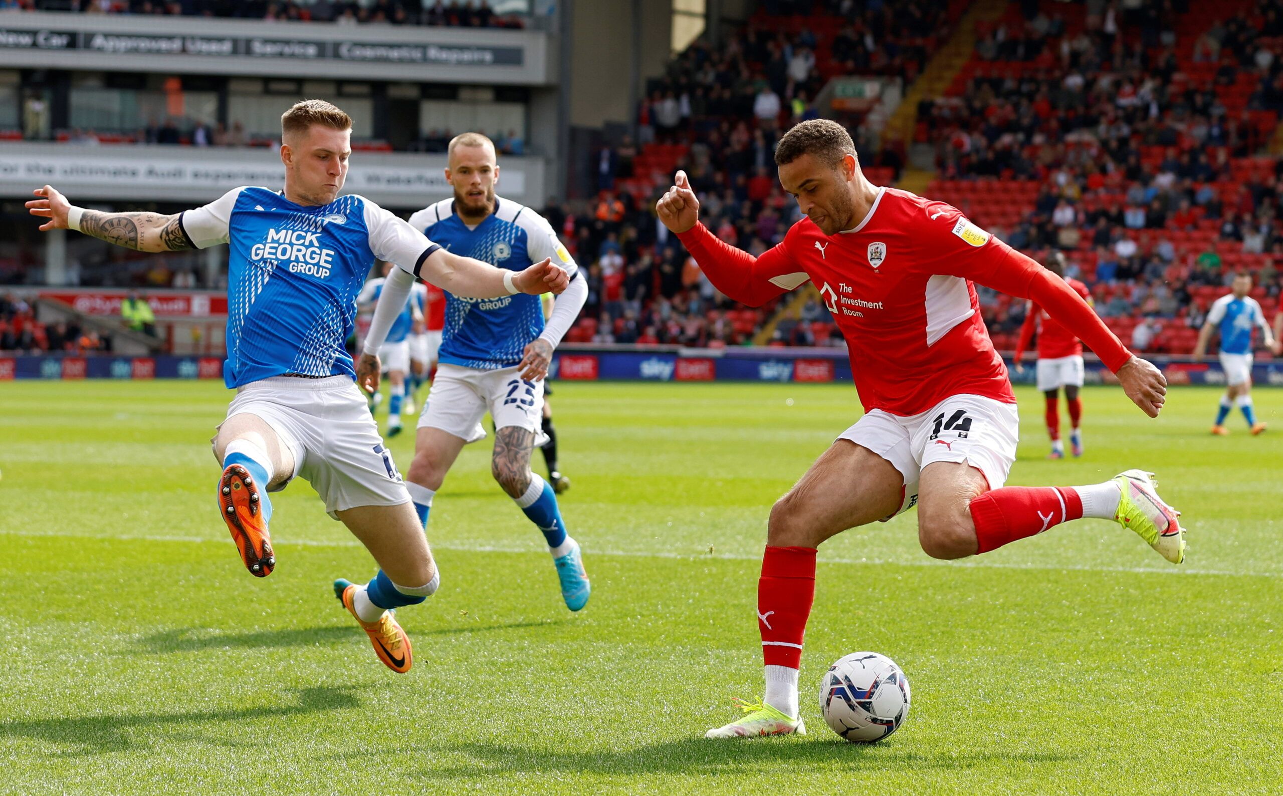 Soccer Football - Championship - Barnsley v Peterborough United - Oakwell, Barnsley, Britain - April 18, 2022  Barnsley's Carlton Morris in action with Peterborough United's Josh Knight  Action Images/Jason Cairnduff  EDITORIAL USE ONLY. No use with unauthorized audio, video, data, fixture lists, club/league logos or 