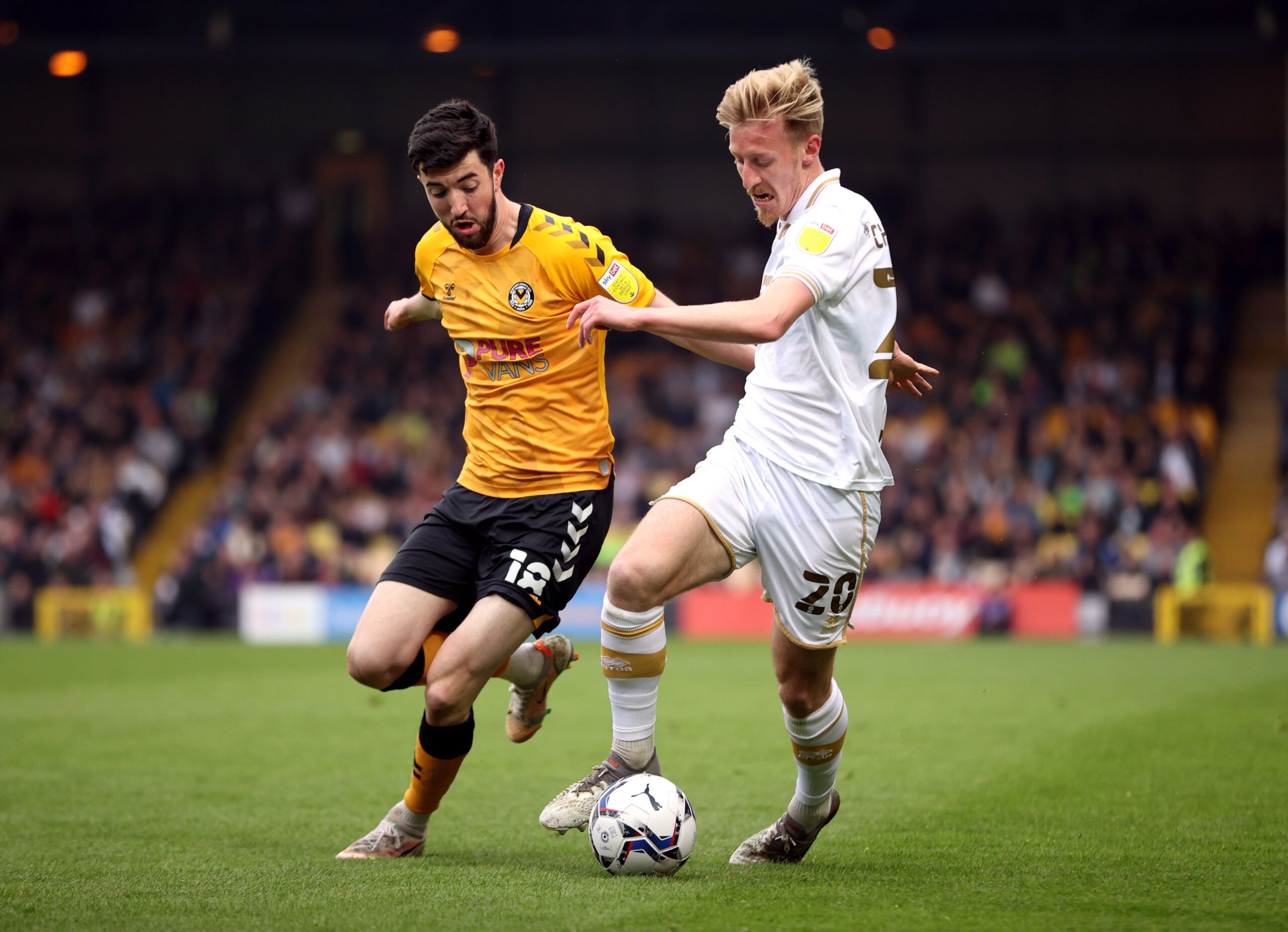 Soccer Football - League Two - Port Vale v Newport County - Vale Park, Stoke-on-Trent, Britain- May 2, 2022 Newport County's Finn Azaz in action with Port Vale's Harry Charsley Action Images/Molly Darlington EDITORIAL USE ONLY. No use with unauthorized audio, video, data, fixture lists, club/league logos or 'live' services. Online in-match use limited to 75 images, no video emulation. No use in betting, games or single club /league/player publications.  Please contact your account representative