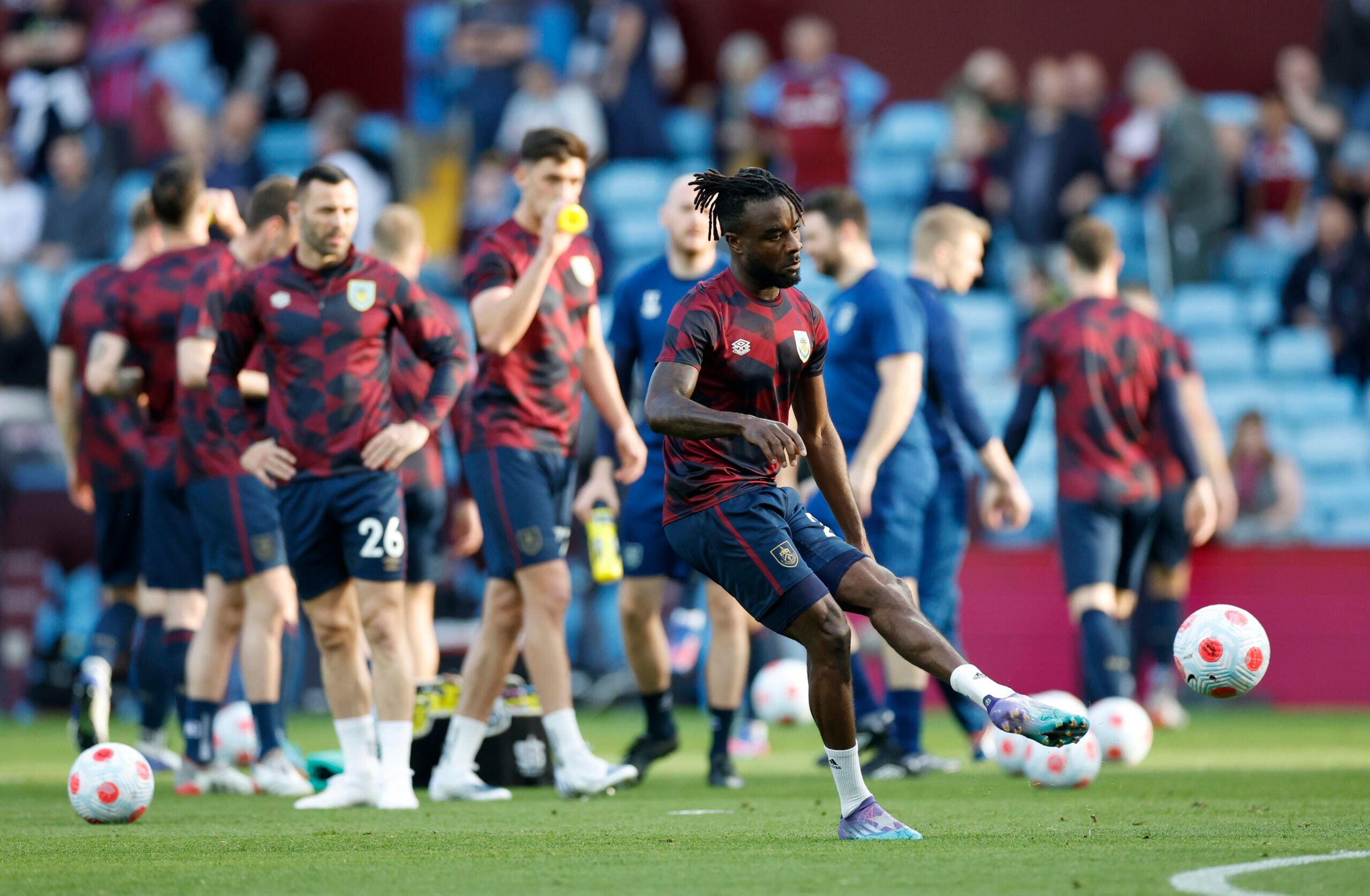 Soccer Football - Premier League - Aston Villa v Burnley - Villa Park, Birmingham, Britain - May 19, 2022 Burnley's Maxwel Cornet with teammates during the warm up before the match Action Images via Reuters/Peter Cziborra EDITORIAL USE ONLY. No use with unauthorized audio, video, data, fixture lists, club/league logos or 'live' services. Online in-match use limited to 75 images, no video emulation. No use in betting, games or single club /league/player publications.  Please contact your account 