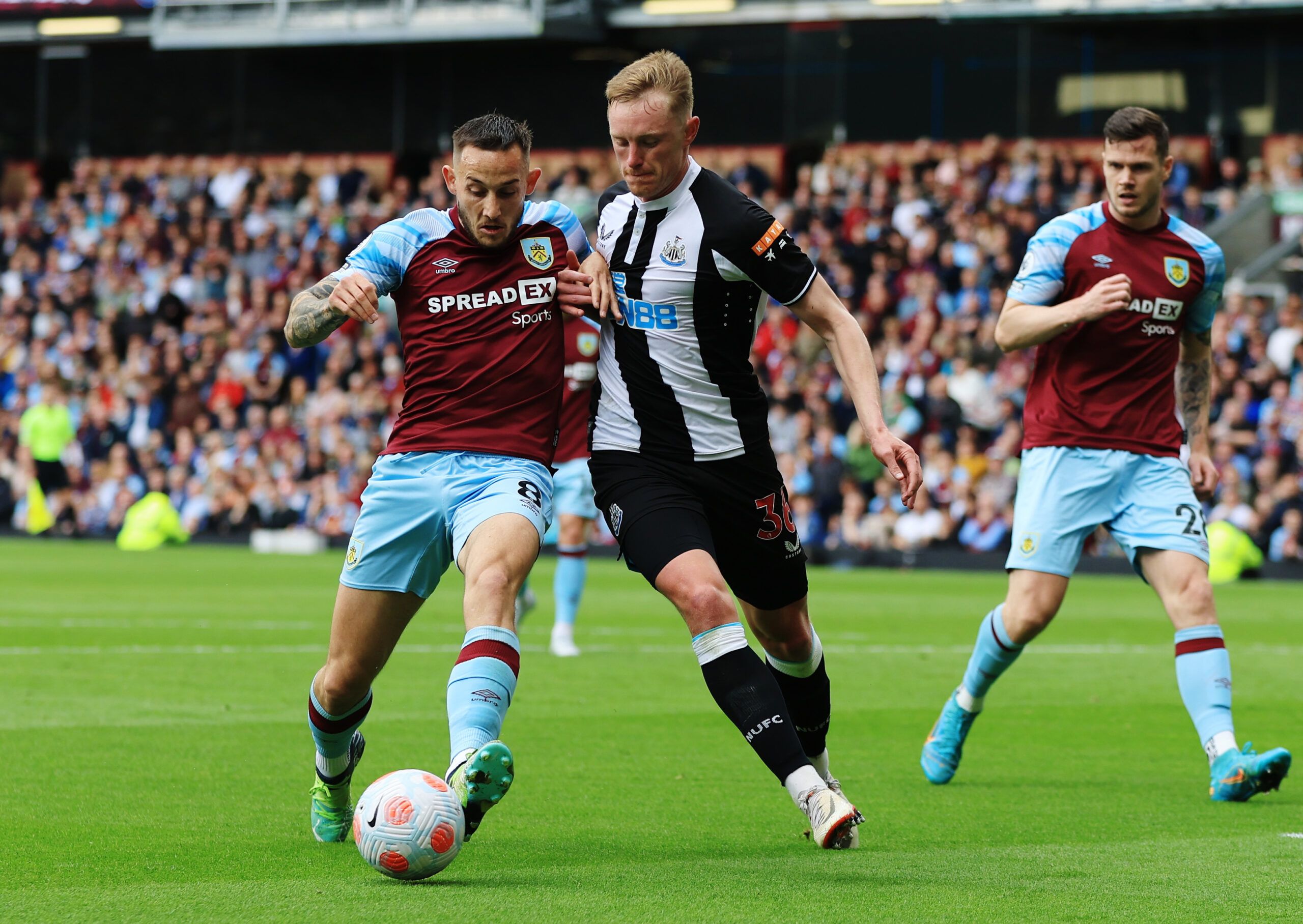 Soccer Football - Premier League - Burnley v Newcastle United - Turf Moor, Burnley, Britain - May 22, 2022 Burnley's Josh Brownhill in action with Newcastle United's Sean Longstaff Action Images via Reuters/Lee Smith EDITORIAL USE ONLY. No use with unauthorized audio, video, data, fixture lists, club/league logos or 'live' services. Online in-match use limited to 75 images, no video emulation. No use in betting, games or single club /league/player publications.  Please contact your account repre