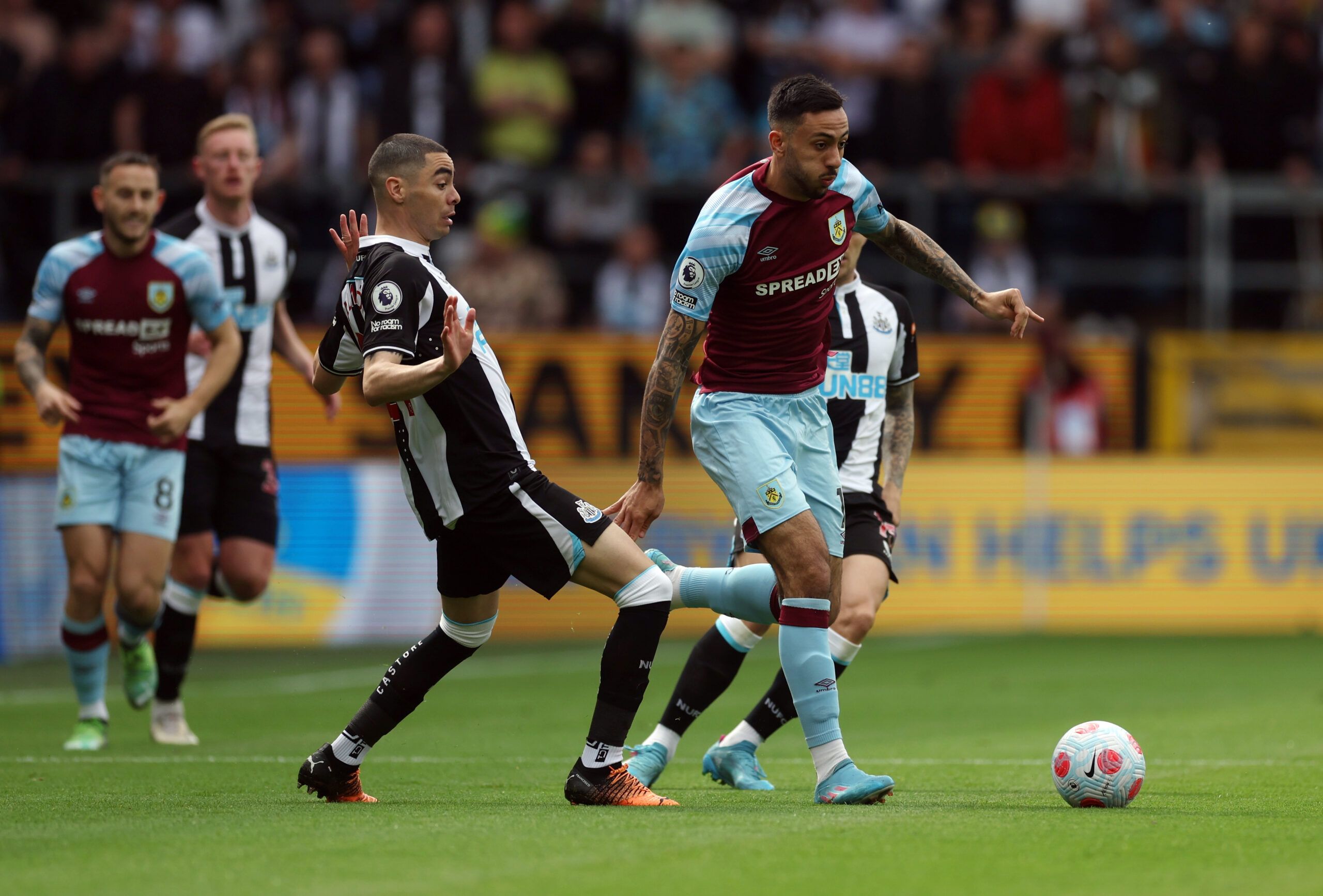Soccer Football - Premier League - Burnley v Newcastle United - Turf Moor, Burnley, Britain - May 22, 2022 Burnley's Dwight McNeil in action with Newcastle United's Miguel Almiron Action Images via Reuters/Lee Smith EDITORIAL USE ONLY. No use with unauthorized audio, video, data, fixture lists, club/league logos or 'live' services. Online in-match use limited to 75 images, no video emulation. No use in betting, games or single club /league/player publications.  Please contact your account repres