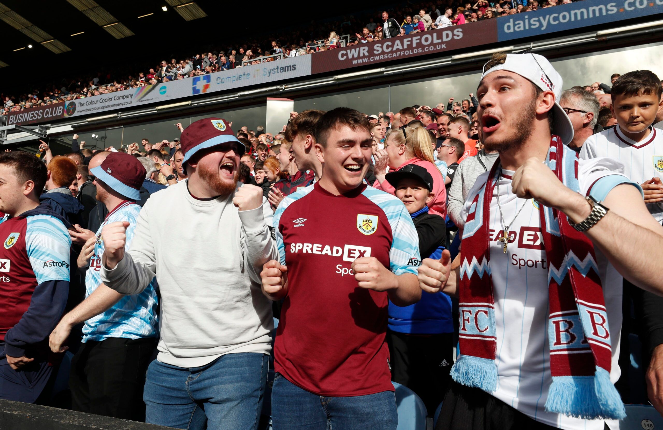 Soccer Football - Premier League - Burnley v Newcastle United - Turf Moor, Burnley, Britain - May 22, 2022 Burnley fans celebrate a Brentford goal versus Leeds United Action Images via Reuters/Lee Smith EDITORIAL USE ONLY. No use with unauthorized audio, video, data, fixture lists, club/league logos or 'live' services. Online in-match use limited to 75 images, no video emulation. No use in betting, games or single club /league/player publications.  Please contact your account representative for 