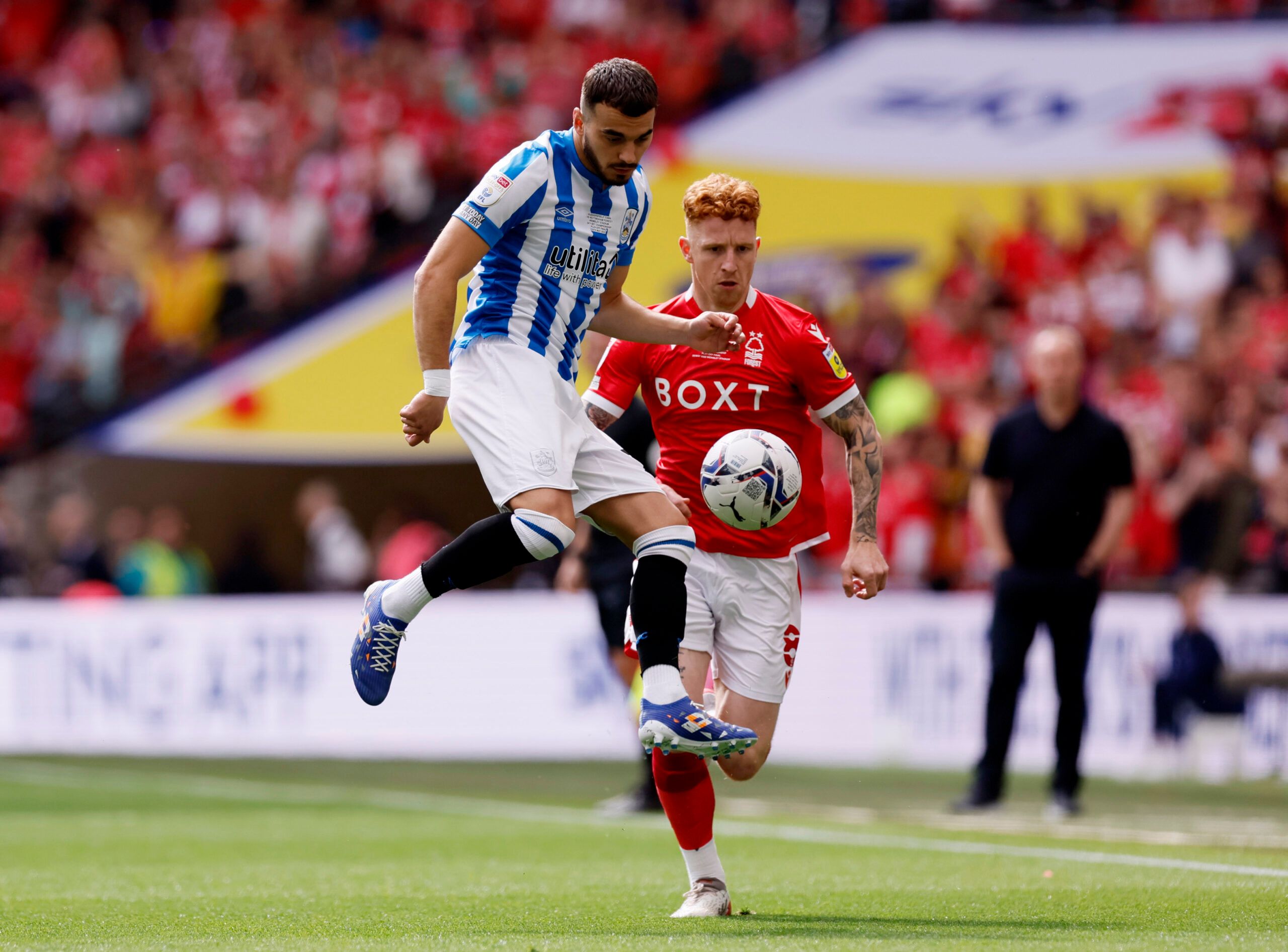 Soccer Football - Championship Play-Off Final - Huddersfield Town v Nottingham Forest - Wembley Stadium, London, Britain - May 29, 2022 Huddersfield Town's Danel Sinani in action with Nottingham Forest's Jack Colback Action Images via Reuters/Andrew Couldridge