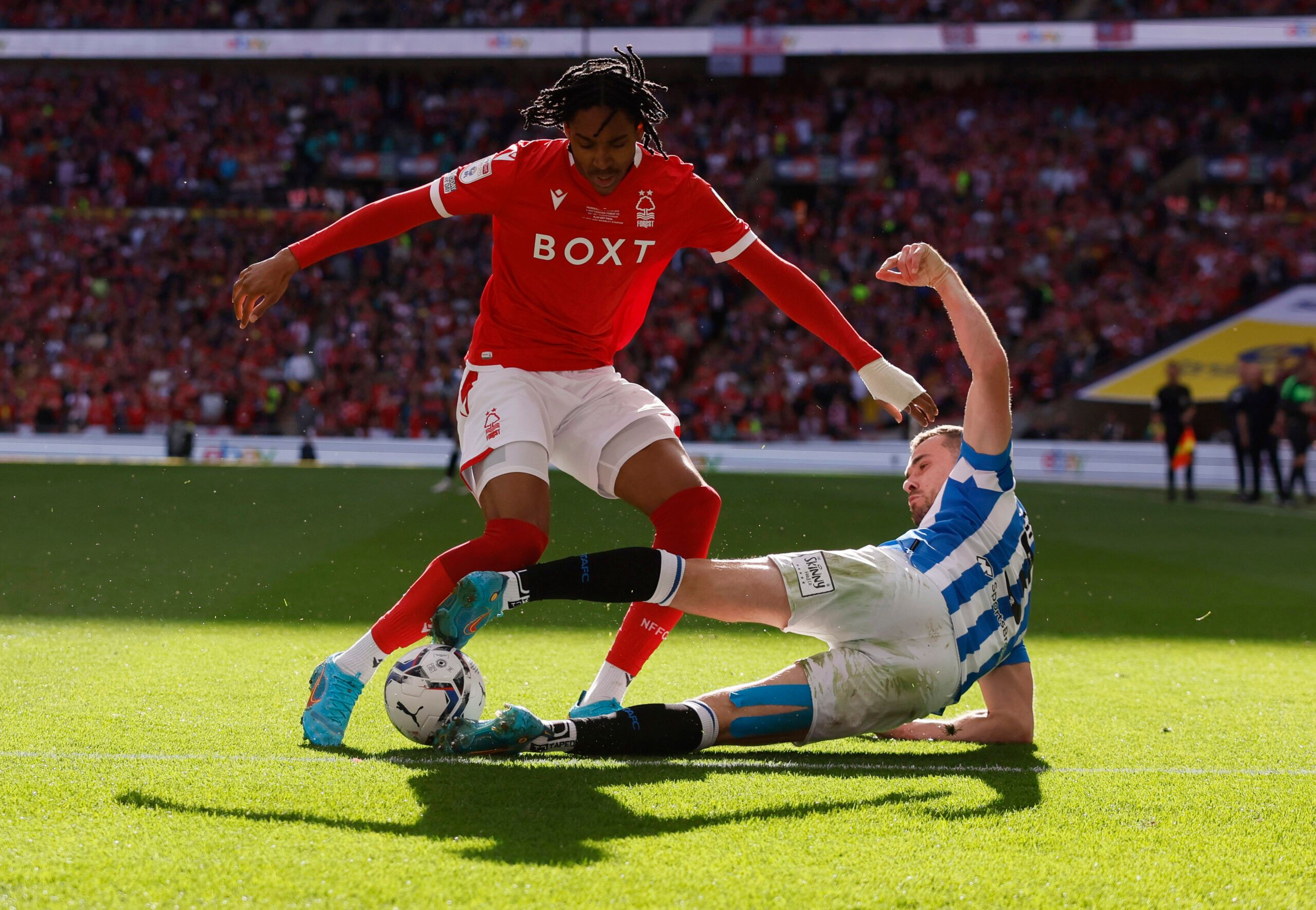 Soccer Football - Championship Play-Off Final - Huddersfield Town v Nottingham Forest - Wembley Stadium, London, Britain - May 29, 2022 Nottingham Forest's Djed Spence in action with Huddersfield Town's Harry Toffolo Action Images via Reuters/Andrew Couldridge