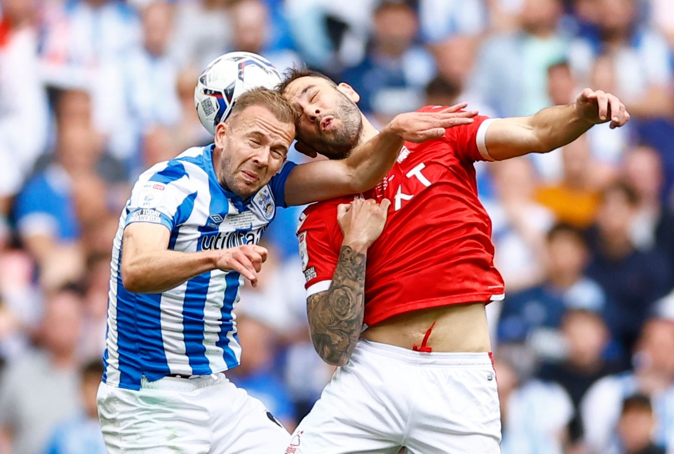 Soccer Football - Championship Play-Off Final - Huddersfield Town v Nottingham Forest - Wembley Stadium, London, Britain - May 29, 2022 Huddersfield Town's Jordan Rhodes in action with Nottingham Forest's Steve Cook Action Images via Reuters/Andrew Boyers