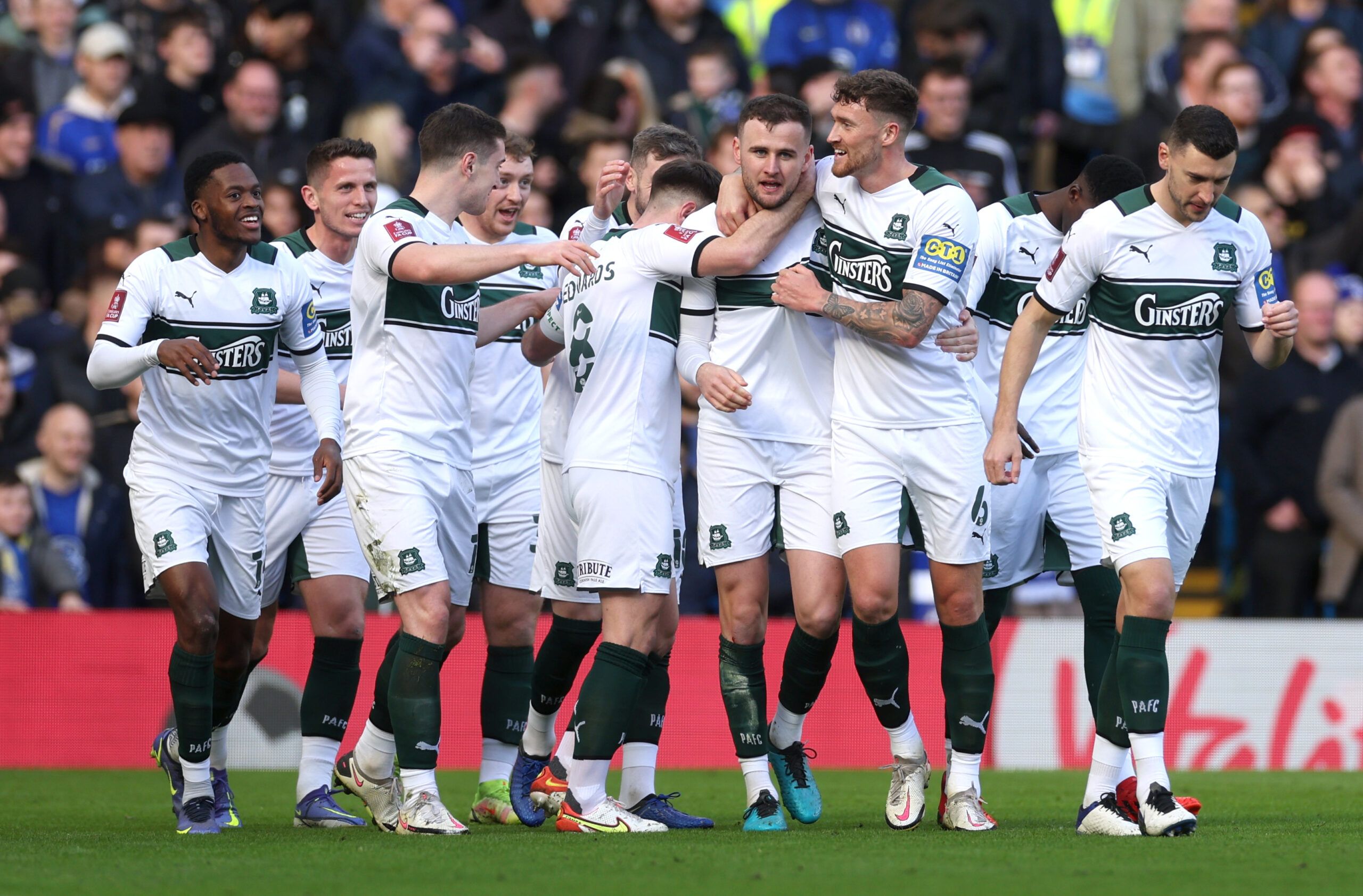 Soccer Football - FA Cup - Fourth Round - Chelsea v Plymouth Argyle - Stamford Bridge, London, Britain - February 5, 2022 Plymouth Argyle's Macaulay Gillesphey celebrates scoring their first goal with teammates Action Images via Reuters/Paul Childs
