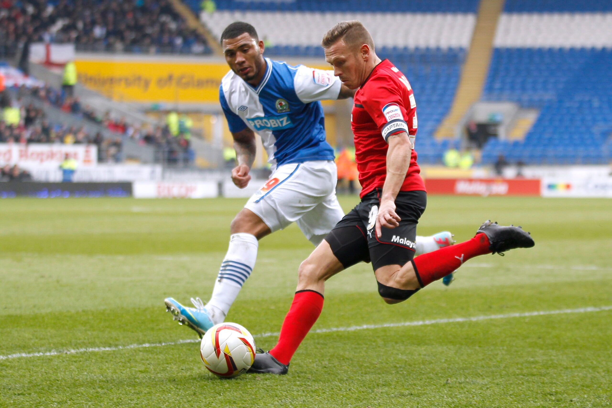 Football - Cardiff City v Blackburn Rovers - npower Football League Championship  - Cardiff City Stadium  - 12/13 - 1/4/13 
Cardiff City's Craig Bellamy in action against Blackburn's Colin Kazim Richards 
Mandatory Credit: Action Images / Paul Harding 
EDITORIAL USE ONLY. No use with unauthorized audio, video, data, fixture lists, club/league logos or live services. Online in-match use limited to 45 images, no video emulation. No use in betting, games or single club/league/player publications.  