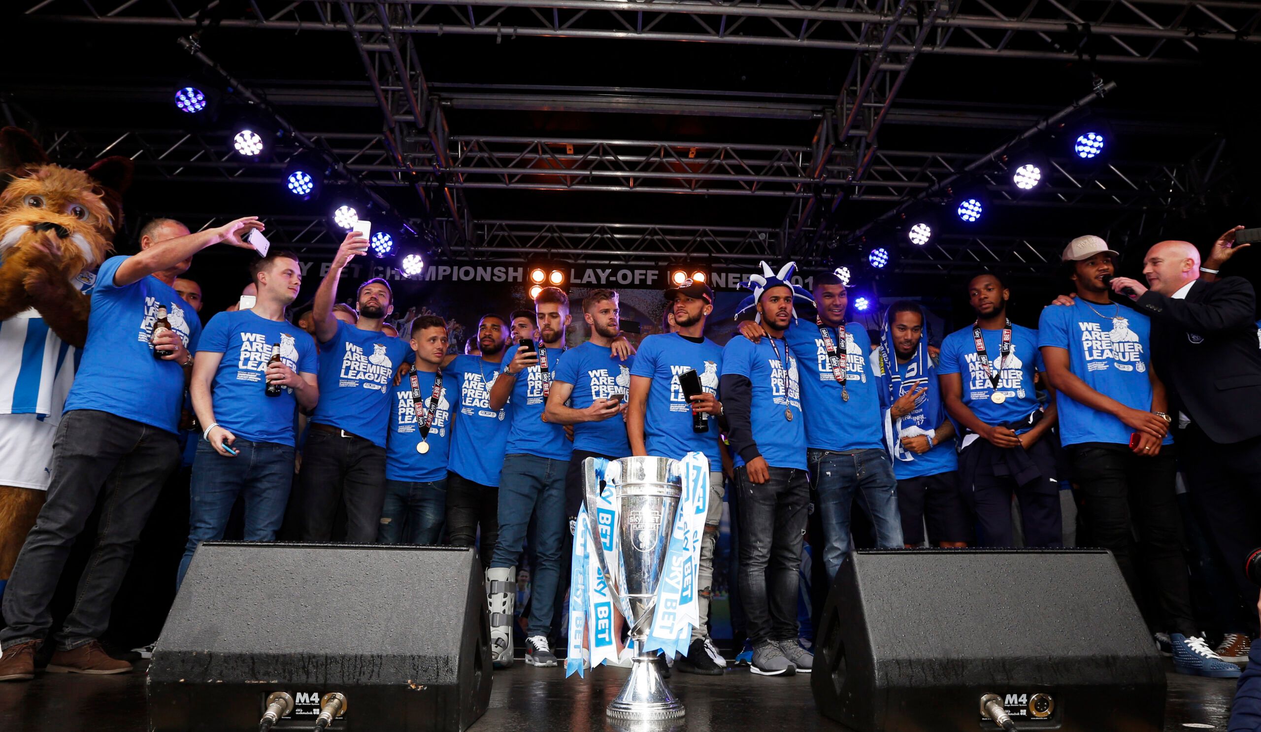 Britain Soccer Football - Huddersfield Town - Premier League Promotion Winners Parade - Huddersfield - 30/5/17 Huddersfield Town celebrate with the trophy during the parade Action Images via Reuters / Ed Sykes Livepic EDITORIAL USE ONLY.