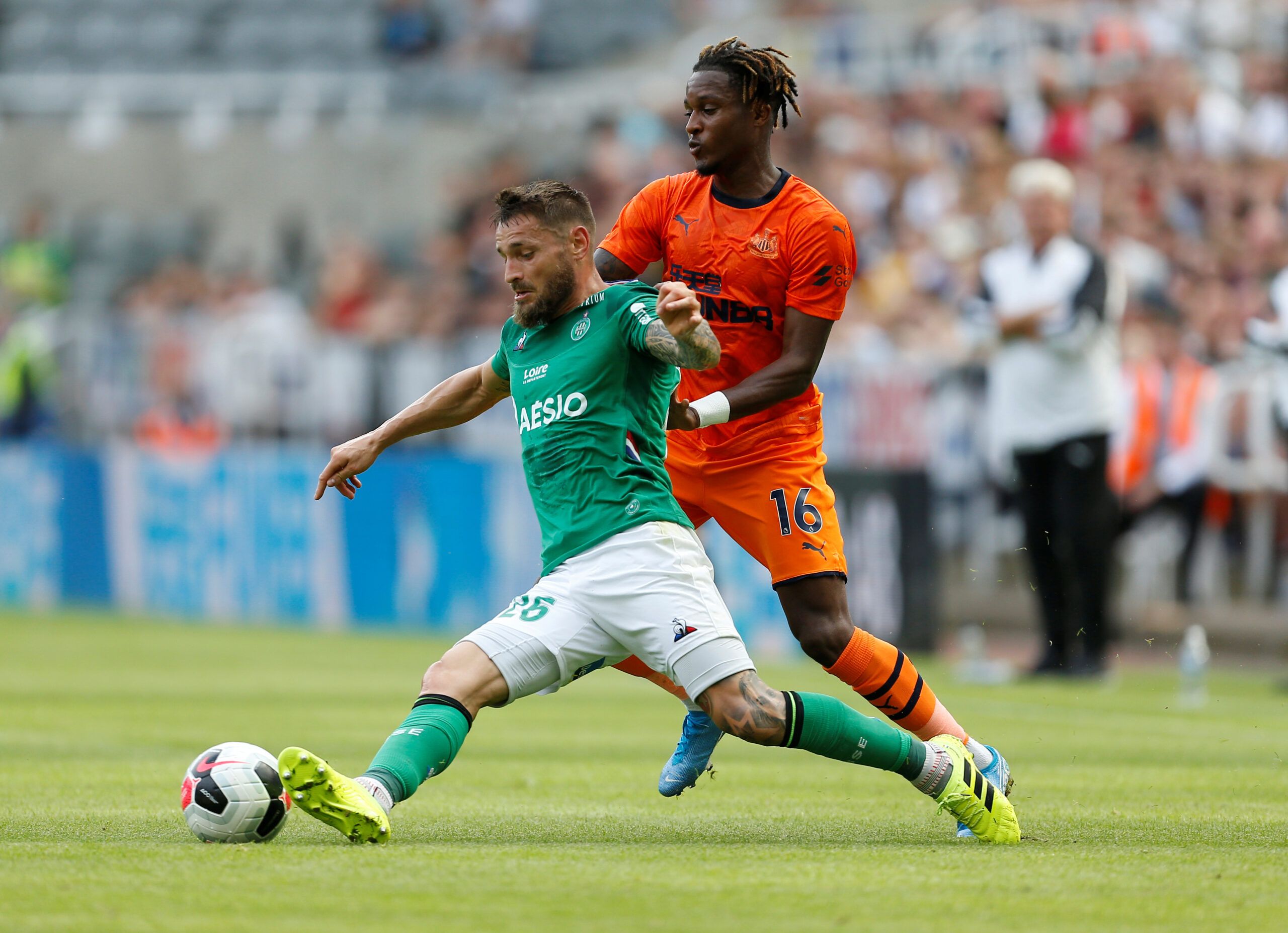 Soccer Football - Pre Season Friendly - Newcastle United v St Etienne - St James' Park, Newcastle, Britain - August 3, 2019   Newcastle United's Rolando Aarons in action with St Etienne's Mathieu Debuchy   Action Images via Reuters/Craig Brough