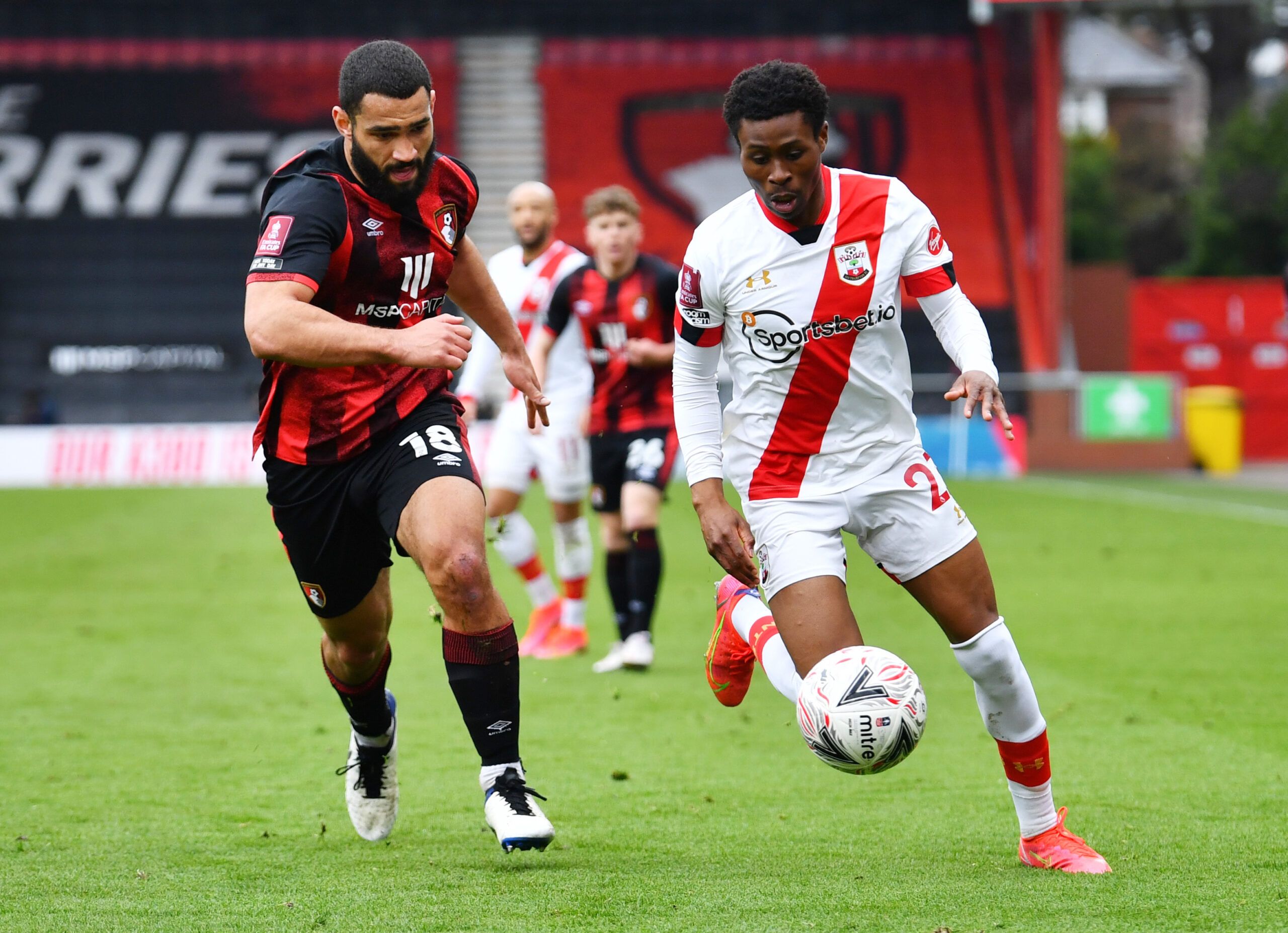 Soccer Football - FA Cup Quarter Final - AFC Bournemouth v Southampton - Vitality Stadium, Bournemouth, Britain - March 20, 2021 Southampton's Nathan Tella in action with AFC Bournemouth's Cameron Carter-Vickers REUTERS/Dylan Martinez