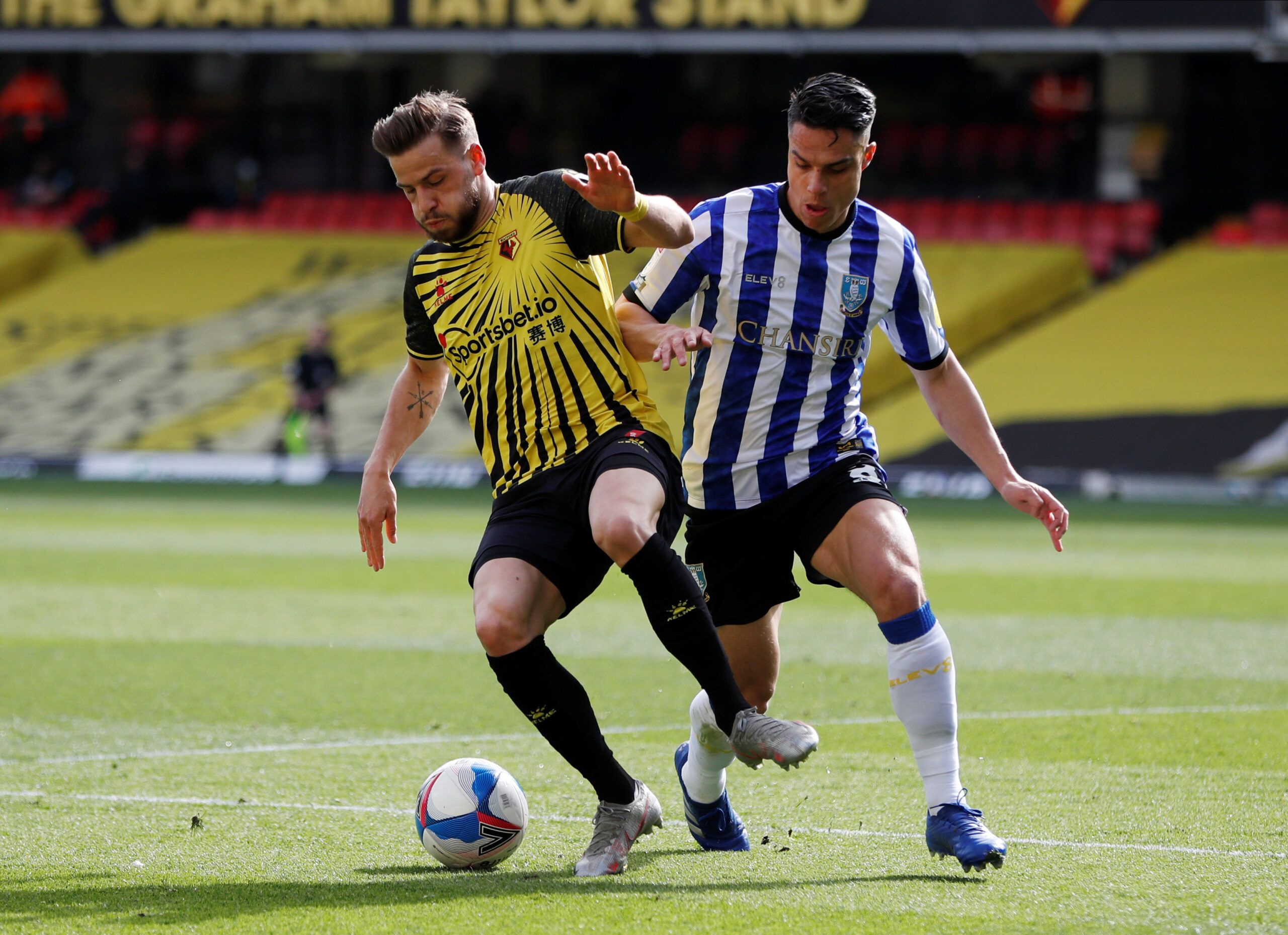 Soccer Football - Championship - Watford v Sheffield Wednesday - Vicarage Road, Watford, Britain - April 2, 2021  Watford's Philip Zinckernagel in action with Sheffield Wednesday's Joey Pelupessy  Action Images/Paul Childs  EDITORIAL USE ONLY. No use with unauthorized audio, video, data, fixture lists, club/league logos or 