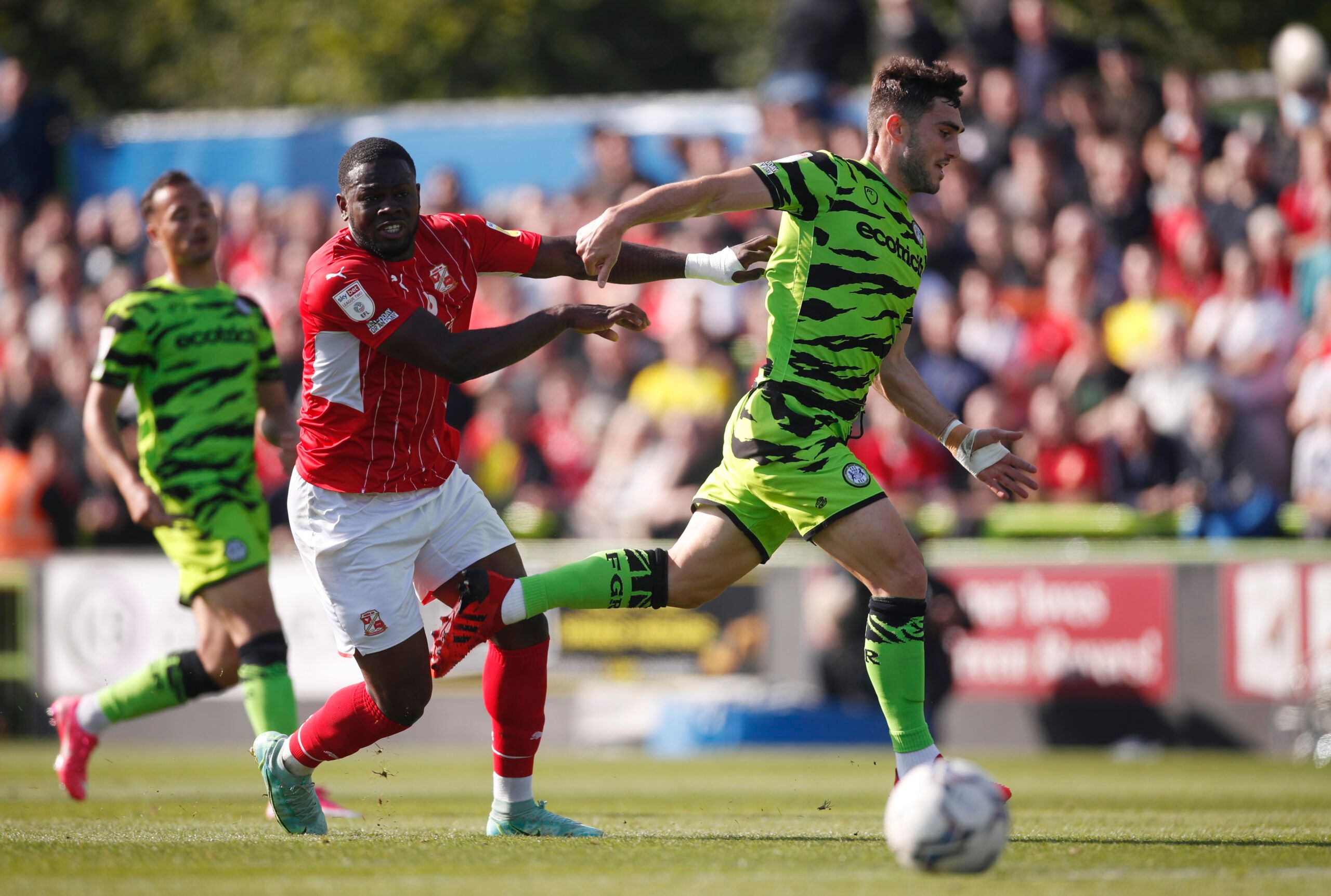 Soccer Football - League Two - Forest Green Rovers v Swindon Town - The New Lawn Stadium, Nailsworth, Britain - October 9, 2021 Forest Green Rovers’ Jordan Moore Taylor in action with Swindon Town’s Tyreece Simpson Action Images/Matthew Childs EDITORIAL USE ONLY. No use with unauthorized audio, video, data, fixture lists, club/league logos or 'live' services. Online in-match use limited to 75 images, no video emulation. No use in betting, games or single club /league/player publications.  Please