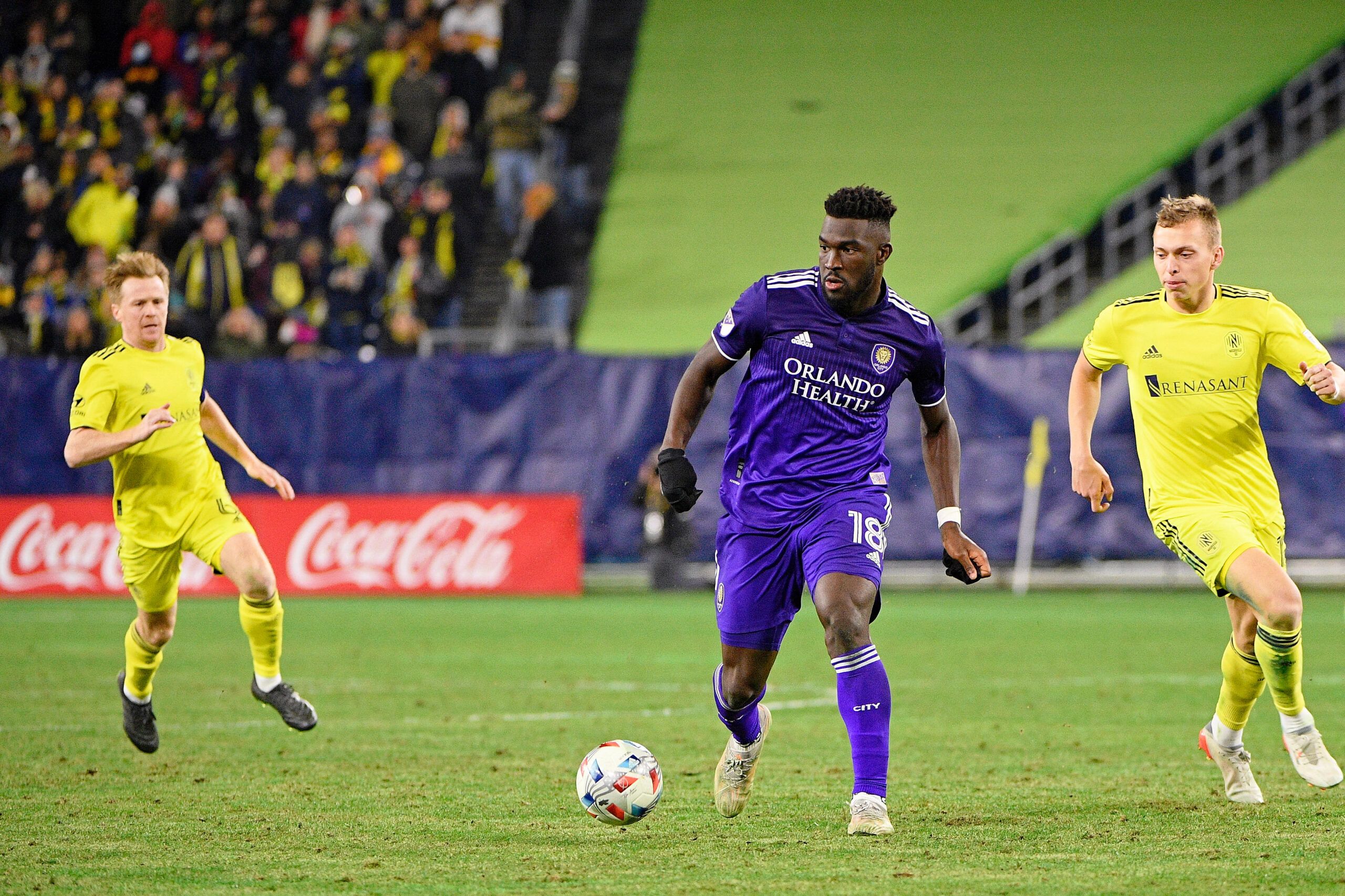Nov 23, 2021; Nashville, TN, USA; Orlando City forward Daryl Dike (18) dribbles the ball against Nashville SC during the second half of a round one MLS Playoff game at Nissan Stadium. Mandatory Credit: Steve Roberts-USA TODAY Sports