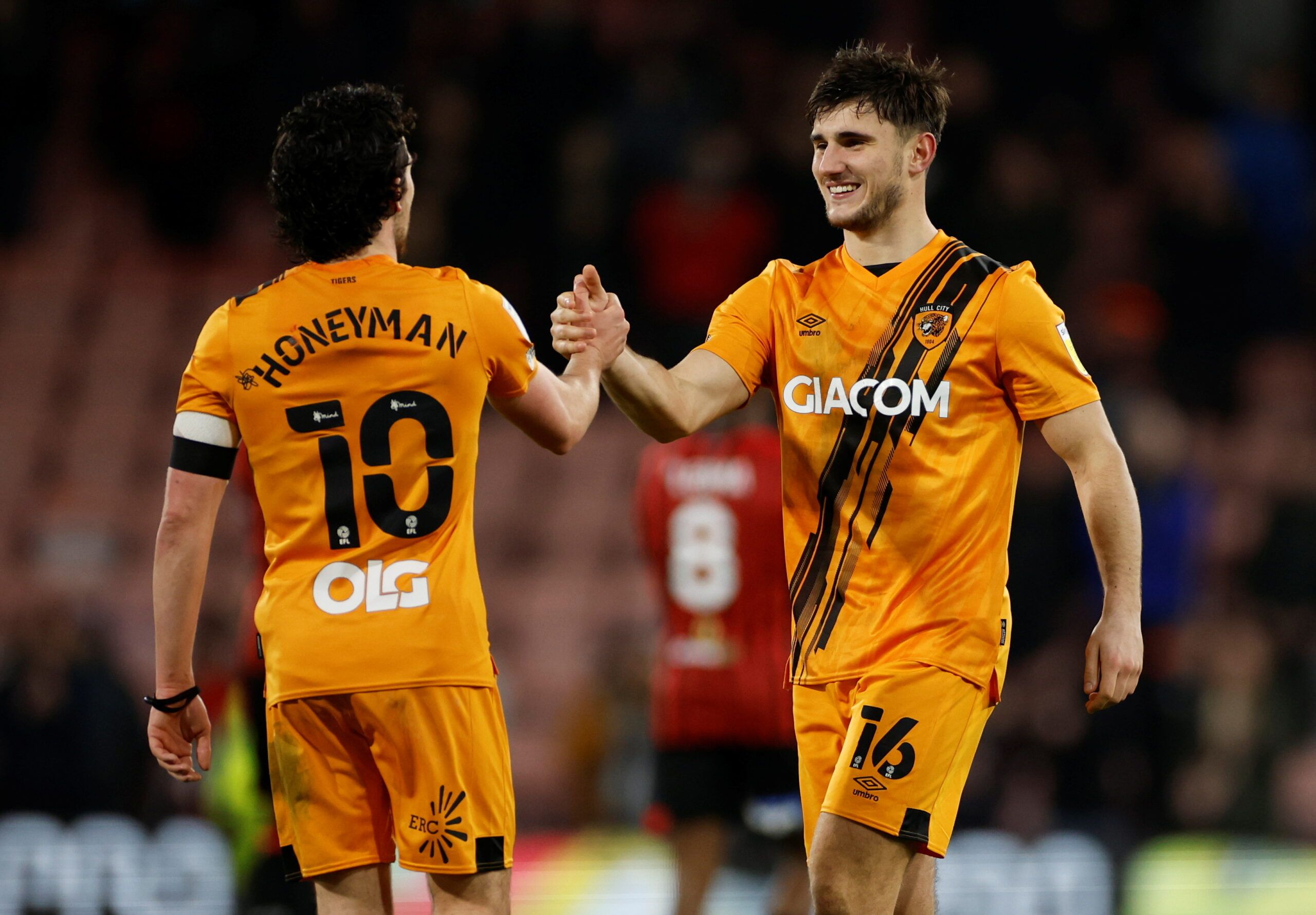 Soccer Football - Championship - AFC Bournemouth v Hull City - Vitality Stadium, Bournemouth, Britain - January 22, 2022 Hull City's Ryan Longman celebrates with George Honeyman after the match    Action Images/John Sibley  EDITORIAL USE ONLY. No use with unauthorized audio, video, data, fixture lists, club/league logos or 