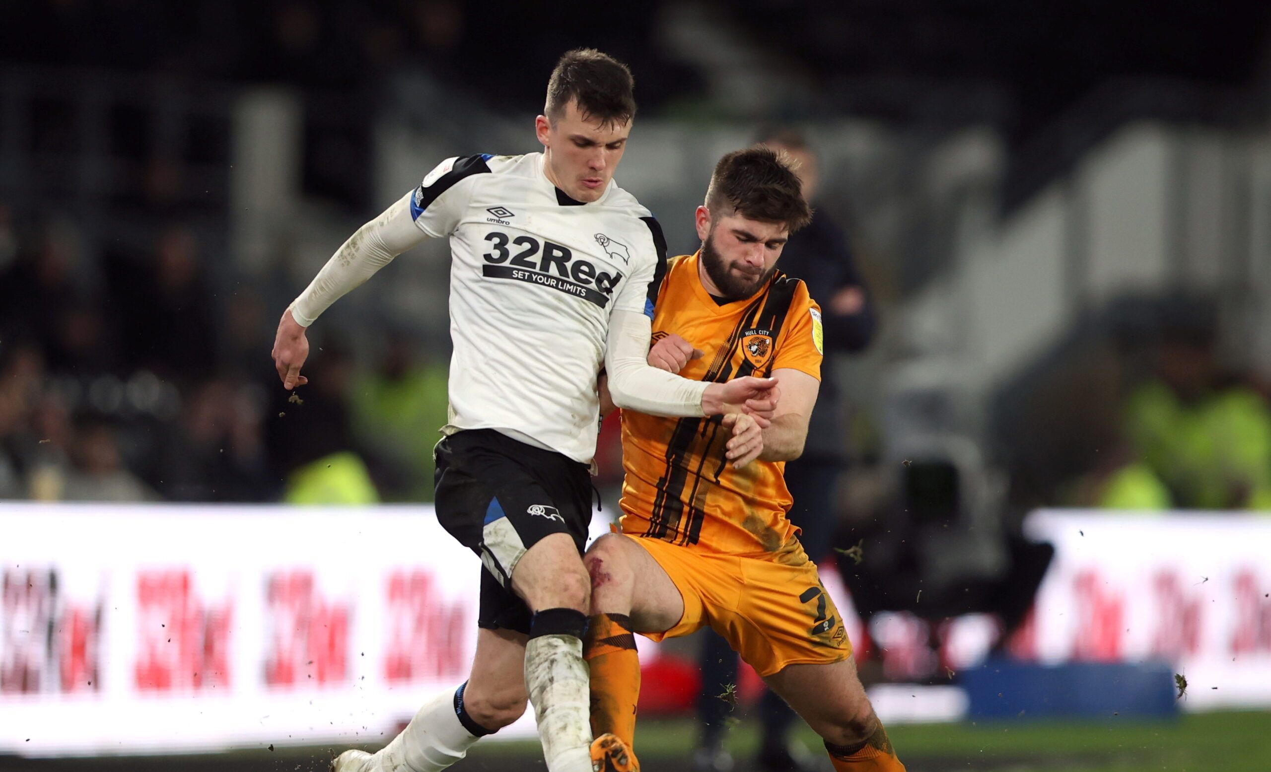 Soccer Football - Championship - Derby County v Hull City - Pride Park, Derby, Britain - February 8, 2022  Derby County's Jason Knight in action with Hull City's Brandon Fleming     Action Images/Molly Darlington  EDITORIAL USE ONLY. No use with unauthorized audio, video, data, fixture lists, club/league logos or 