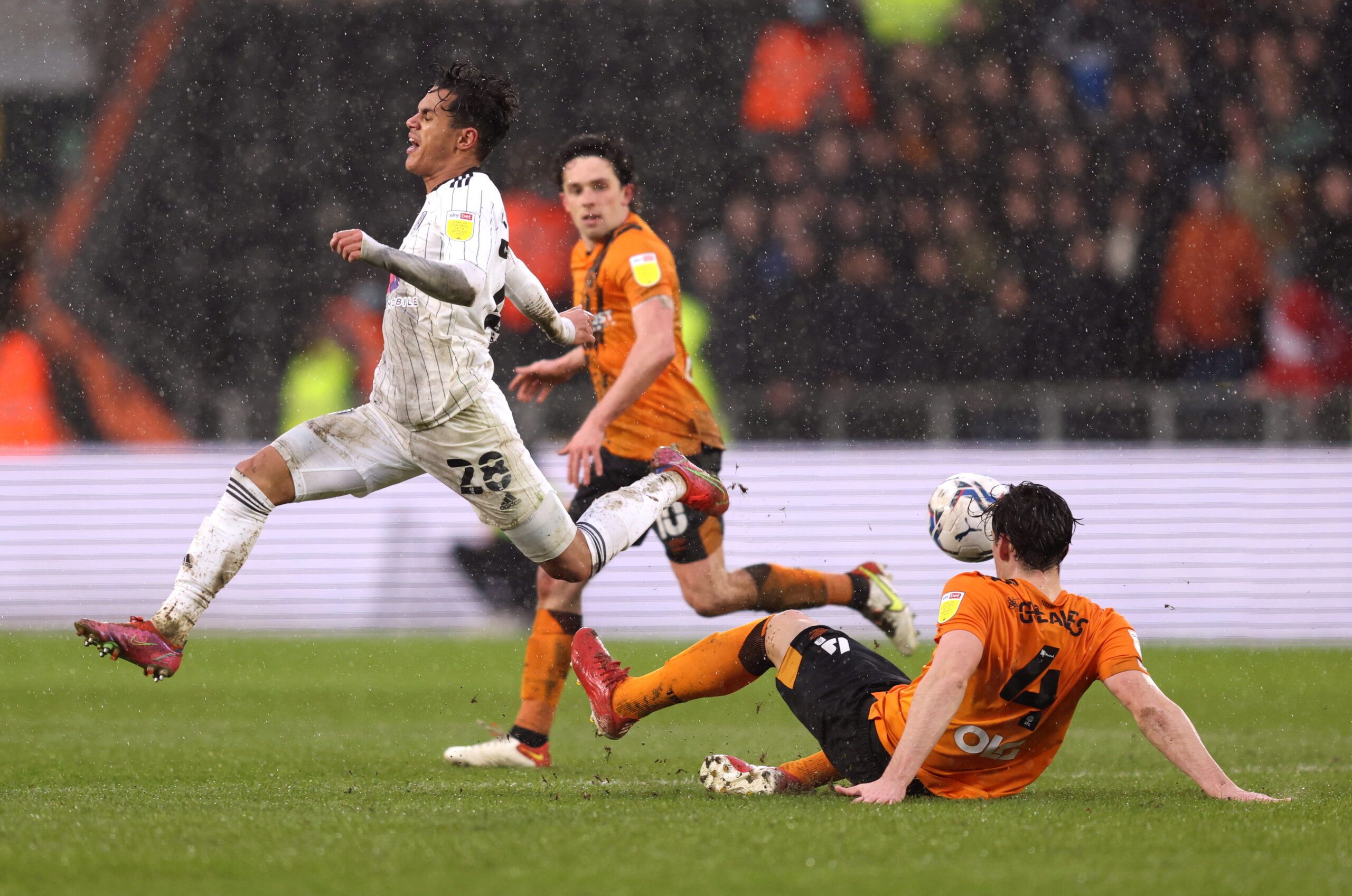 Soccer Football - Championship - Hull City v Fulham - KCOM Stadium, Hull, Britain - February 12, 2022  Fulham's Fabio Carvalho in action with Hull City's Jacob Greaves  Action Images/John Clifton  EDITORIAL USE ONLY. No use with unauthorized audio, video, data, fixture lists, club/league logos or 