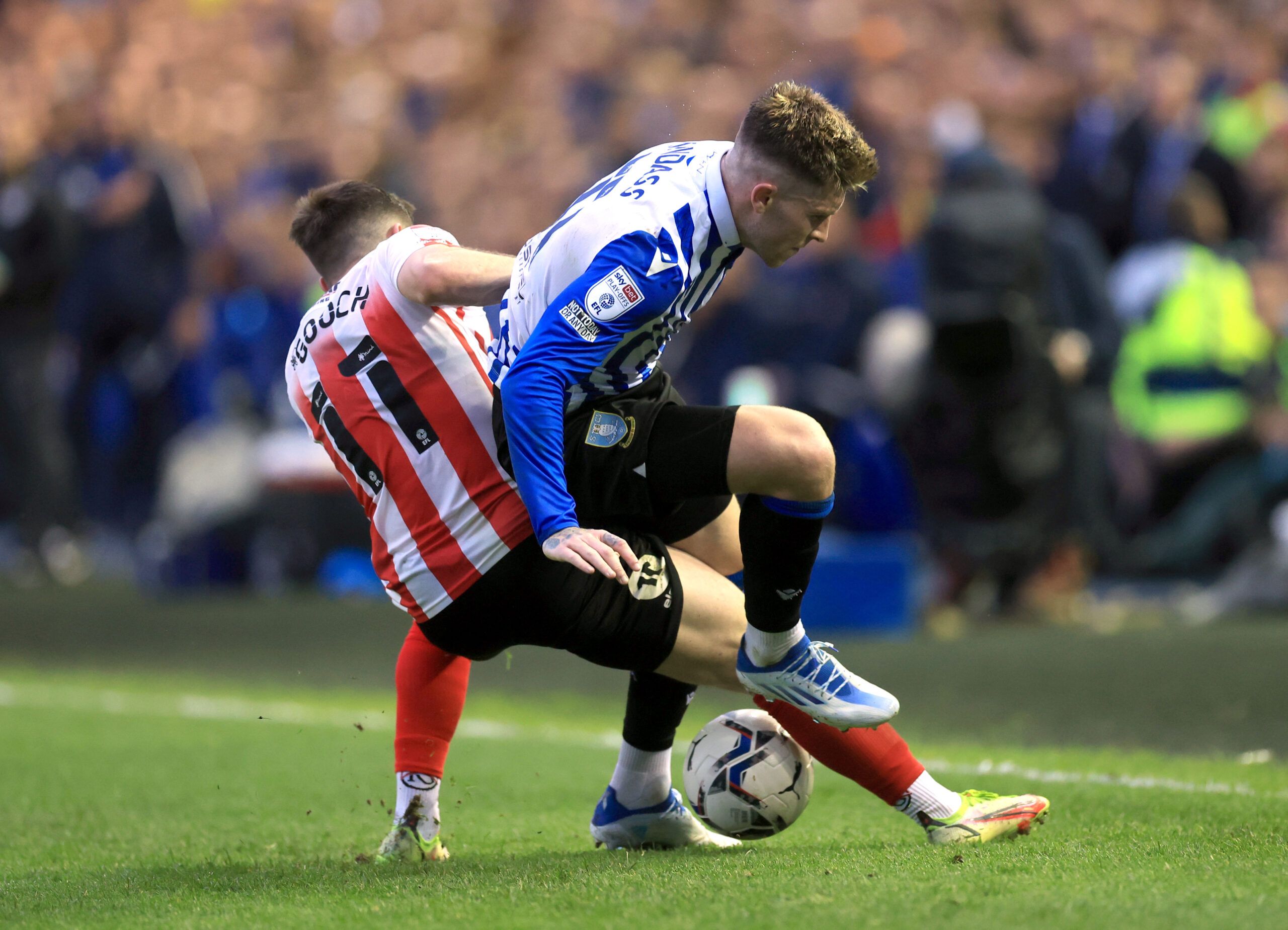 Soccer Football - League One - Play-Off Semi Final Second Leg - Sheffield Wednesday v Sunderland - Hillsborough Stadium, Sheffield, Britain - May 9, 2022 Sunderland's Lynden Gooch in action with Sheffield Wednesday's Josh Windass Action Images/Lee Smith EDITORIAL USE ONLY. No use with unauthorized audio, video, data, fixture lists, club/league logos or 'live' services. Online in-match use limited to 75 images, no video emulation. No use in betting, games or single club /league/player publication
