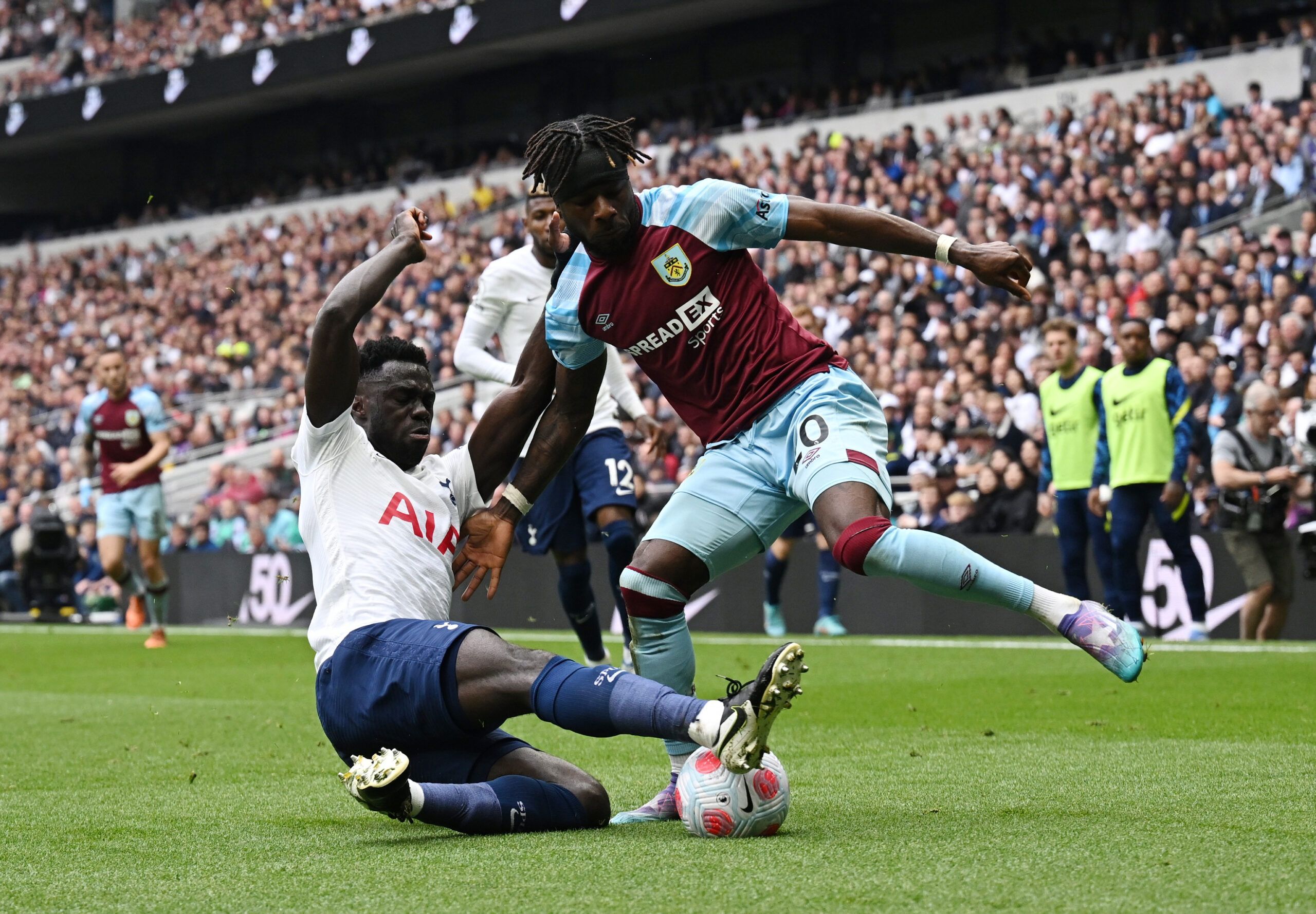 Soccer Football - Premier League - Tottenham Hotspur v Burnley - Tottenham Hotspur Stadium, London, Britain - May 15, 2022 Tottenham Hotspur's Davinson Sanchez in action with Burnley's Maxwel Cornet REUTERS/Dylan Martinez EDITORIAL USE ONLY. No use with unauthorized audio, video, data, fixture lists, club/league logos or 'live' services. Online in-match use limited to 75 images, no video emulation. No use in betting, games or single club /league/player publications.  Please contact your account 