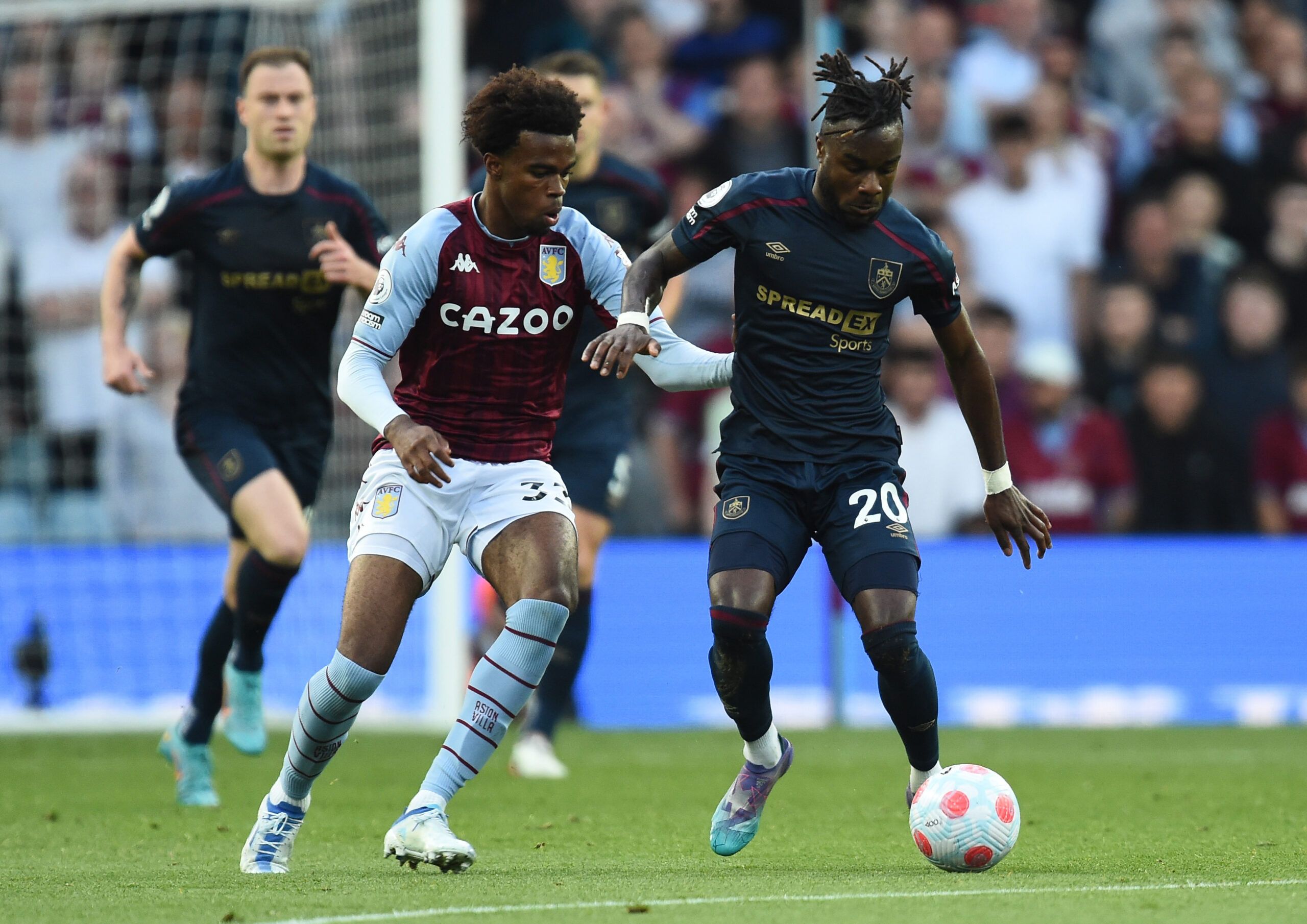Soccer Football - Premier League - Aston Villa v Burnley - Villa Park, Birmingham, Britain - May 19, 2022 Aston Villa's Carney Chukwuemeka in action with Burnley's Maxwel Cornet REUTERS/Peter Powell EDITORIAL USE ONLY. No use with unauthorized audio, video, data, fixture lists, club/league logos or 'live' services. Online in-match use limited to 75 images, no video emulation. No use in betting, games or single club /league/player publications.  Please contact your account representative for furt