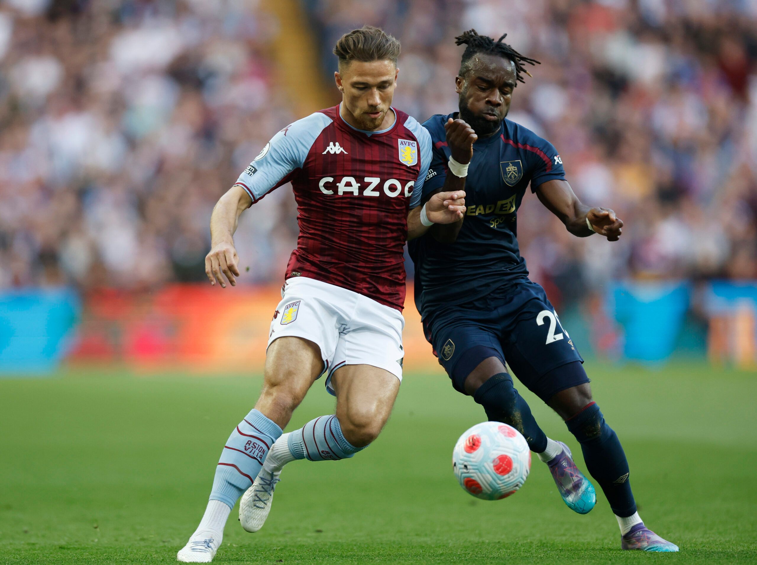 Soccer Football - Premier League - Aston Villa v Burnley - Villa Park, Birmingham, Britain - May 19, 2022 Aston Villa's Matty Cash in action with Burnley's Maxwel Cornet Action Images via Reuters/Peter Cziborra EDITORIAL USE ONLY. No use with unauthorized audio, video, data, fixture lists, club/league logos or 'live' services. Online in-match use limited to 75 images, no video emulation. No use in betting, games or single club /league/player publications.  Please contact your account representat