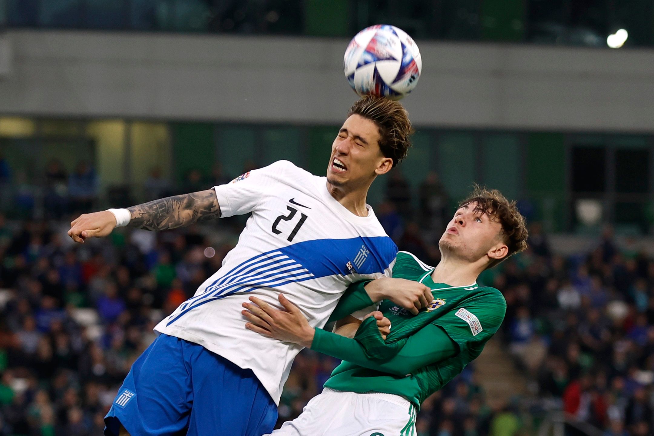 Soccer Football - UEFA Nations League - Group J - Northern Ireland v Greece - Windsor Park, Belfast, Northern Ireland, Britain - June 2, 2022 Greece's Konstantinos Tsimikas in action with Northern Ireland's Conor Bradley Action Images via Reuters/Jason Cairnduff