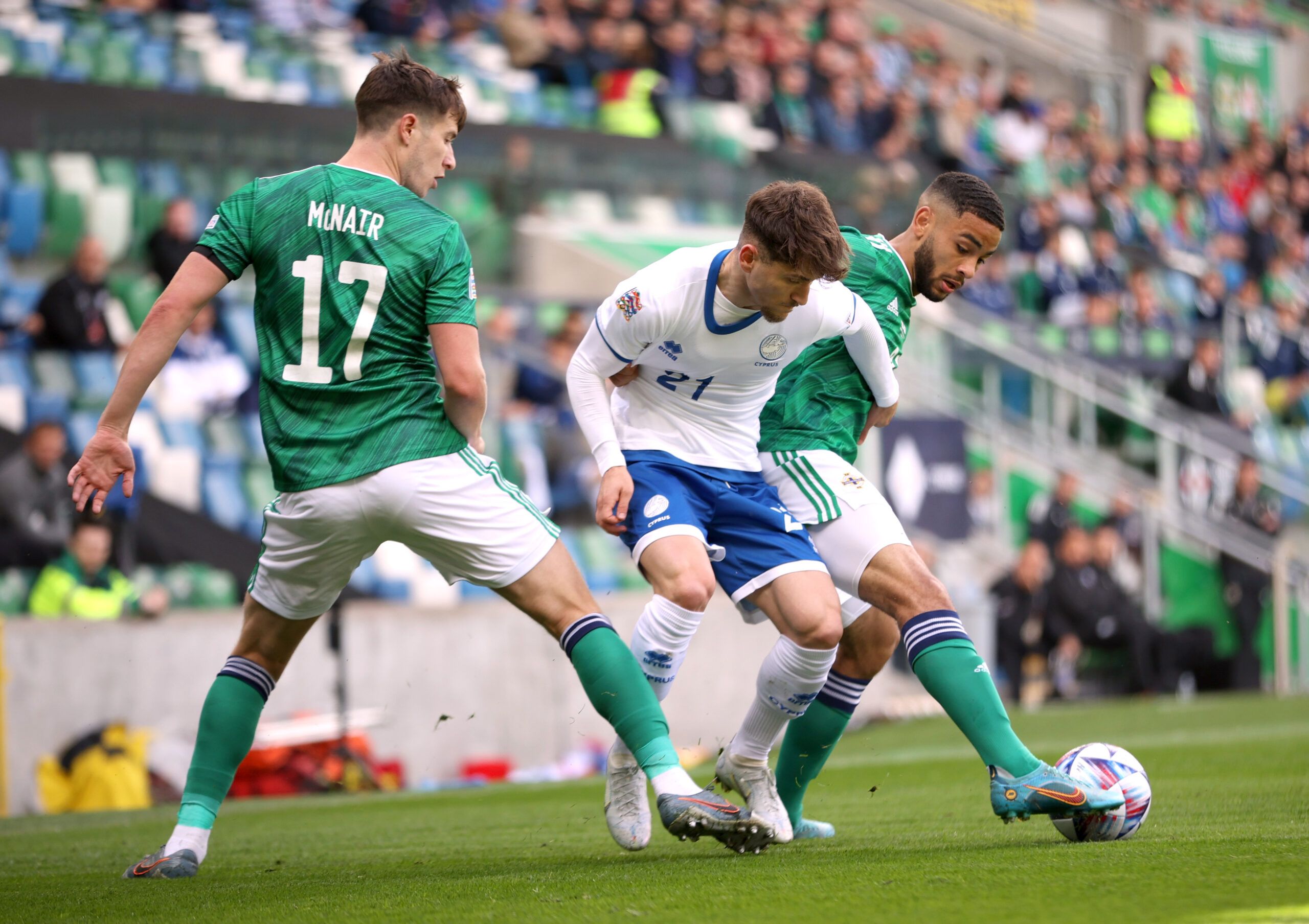 Soccer Football - UEFA Nations League - Group J - Northern Ireland v Cyprus - Windsor Park, Belfast, Northern Ireland, Britain - June 12, 2022 Northern Ireland's Brodie Spencer and Paddy McNair in action with Cyprus' Marinos Tzionis Action Images via Reuters/Molly Darlington