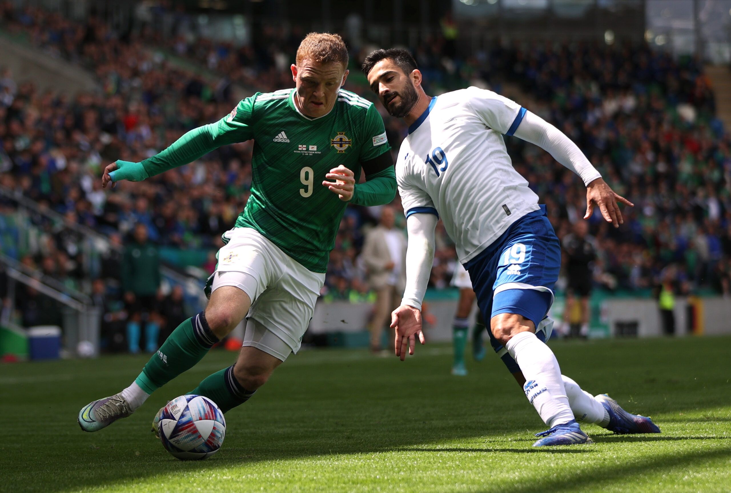 Soccer Football - UEFA Nations League - Group J - Northern Ireland v Cyprus - Windsor Park, Belfast, Northern Ireland, Britain - June 12, 2022 Northern Ireland's Shayne Lavery in action with Cyprus' Konstantinos Laifis Action Images via Reuters/Molly Darlington
