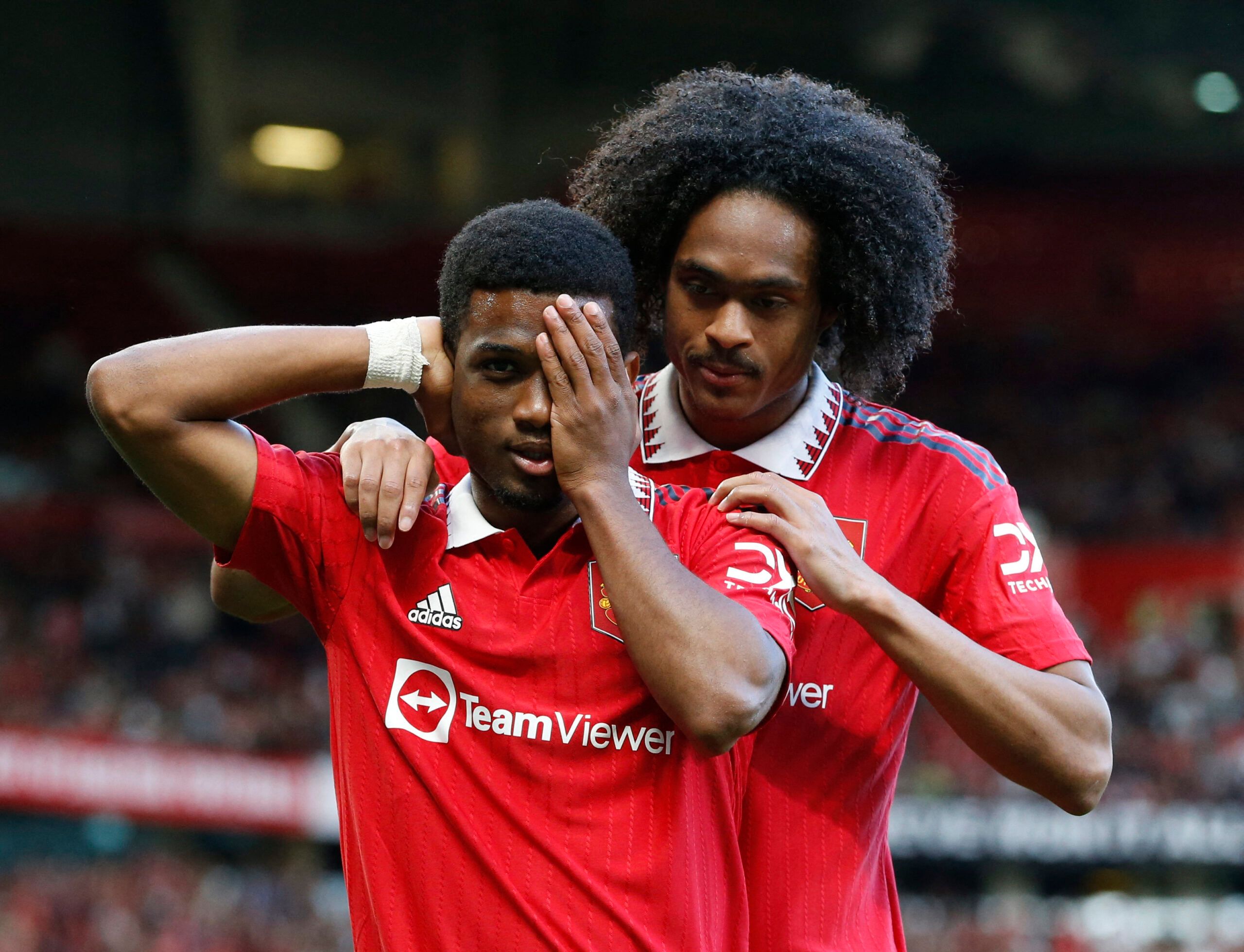 Soccer Football - Pre Season Friendly - Manchester United v Rayo Vallecano - Old Trafford, Manchester, Britain - July 31, 2022 Manchester United's Amad Diallo celebrates scoring their first goal with teammate Tahith Chong Action Images via Reuters/Ed Sykes