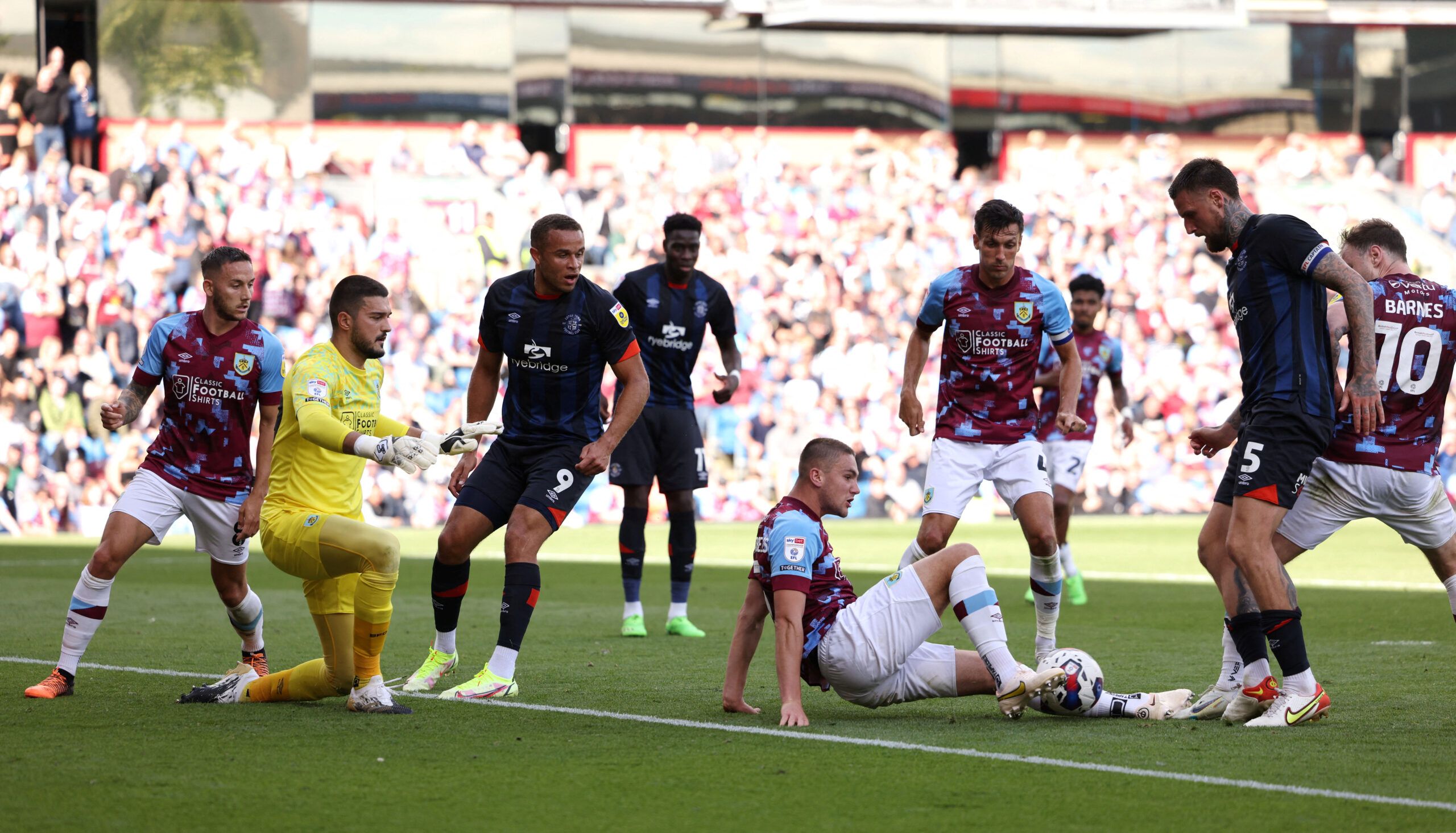 Soccer Football - Championship - Burnley v Luton Town - Turf Moor, Burnley, Britain - August 6, 2022  Burnley's Taylor Harwood-Bellis in action with Luton Town's Sonny Bradley  Action Images/John Clifton  EDITORIAL USE ONLY. No use with unauthorized audio, video, data, fixture lists, club/league logos or 