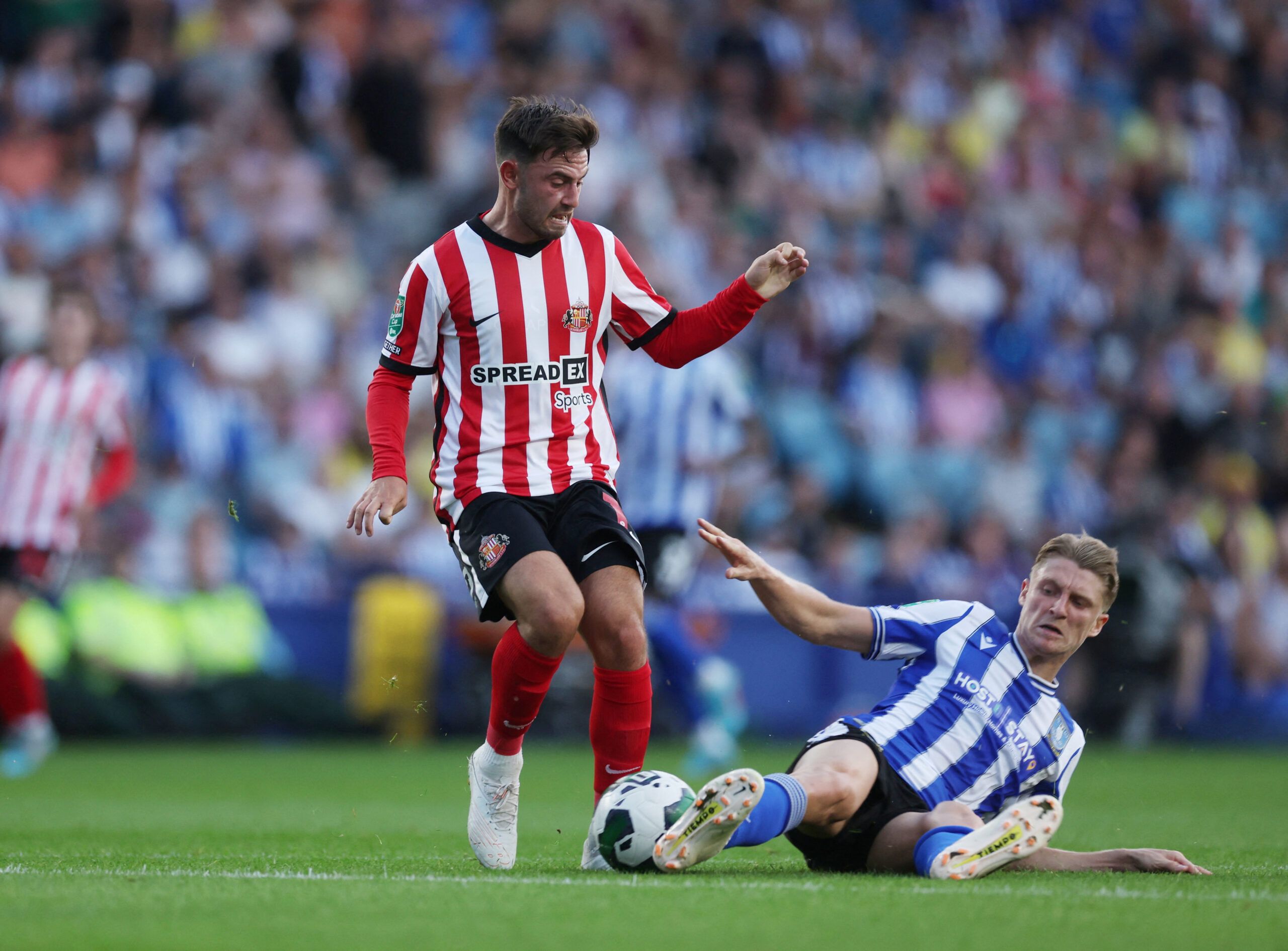 Soccer Football - Carabao Cup - Sheffield Wednesday v Sunderland - Hillsborough Stadium, Sheffield, Britain - August 10, 2022 Sunderland’s Patrick Roberts in action with Sheffield Wednesday’s George Byers  Action Images/Lee Smith  EDITORIAL USE ONLY. No use with unauthorized audio, video, data, fixture lists, club/league logos or 