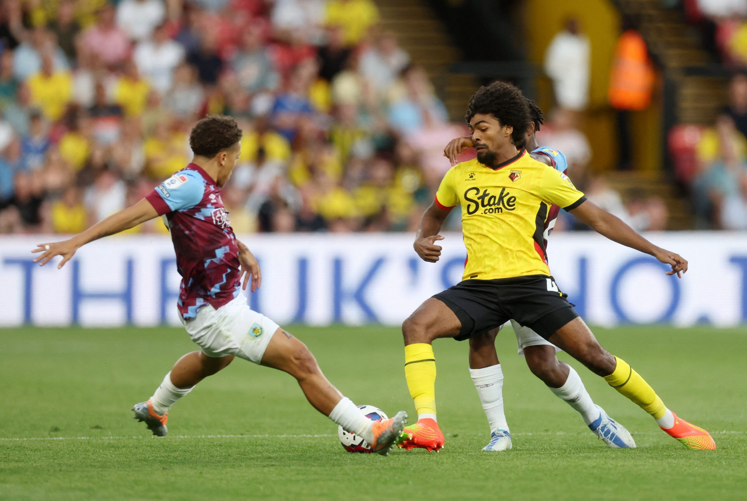 Soccer Football - Championship - Watford v Burnley - Vicarage Road, Watford, Britain - August 12, 2022 Watford's Hamza Choudhury in action with Burnley's Manuel Benson  EDITORIAL USE ONLY. No use with unauthorized audio, video, data, fixture lists, club/league logos or 