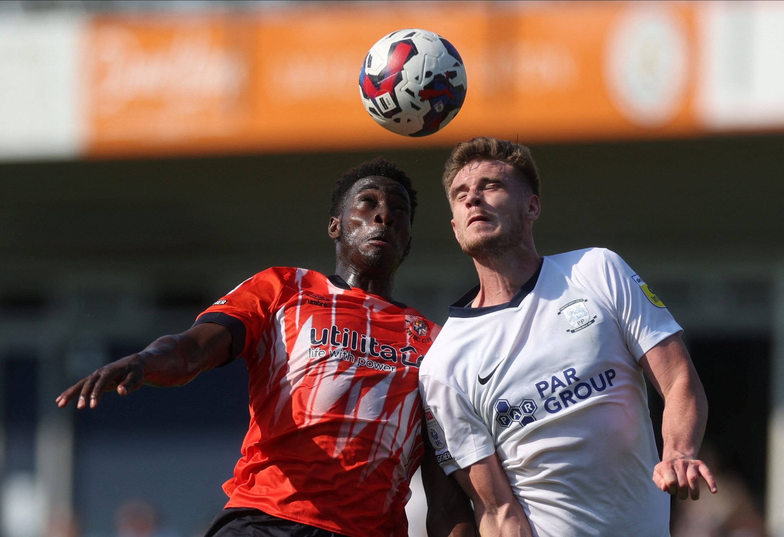 Soccer Football - Championship - Luton Town v Preston North End - Kenilworth Road, Luton, Britain - August 13, 2022 Luton Town's Elijah Adebayo in action with Preston North End's Liam Lindsay Action Images/Paul Childs  EDITORIAL USE ONLY. No use with unauthorized audio, video, data, fixture lists, club/league logos or 