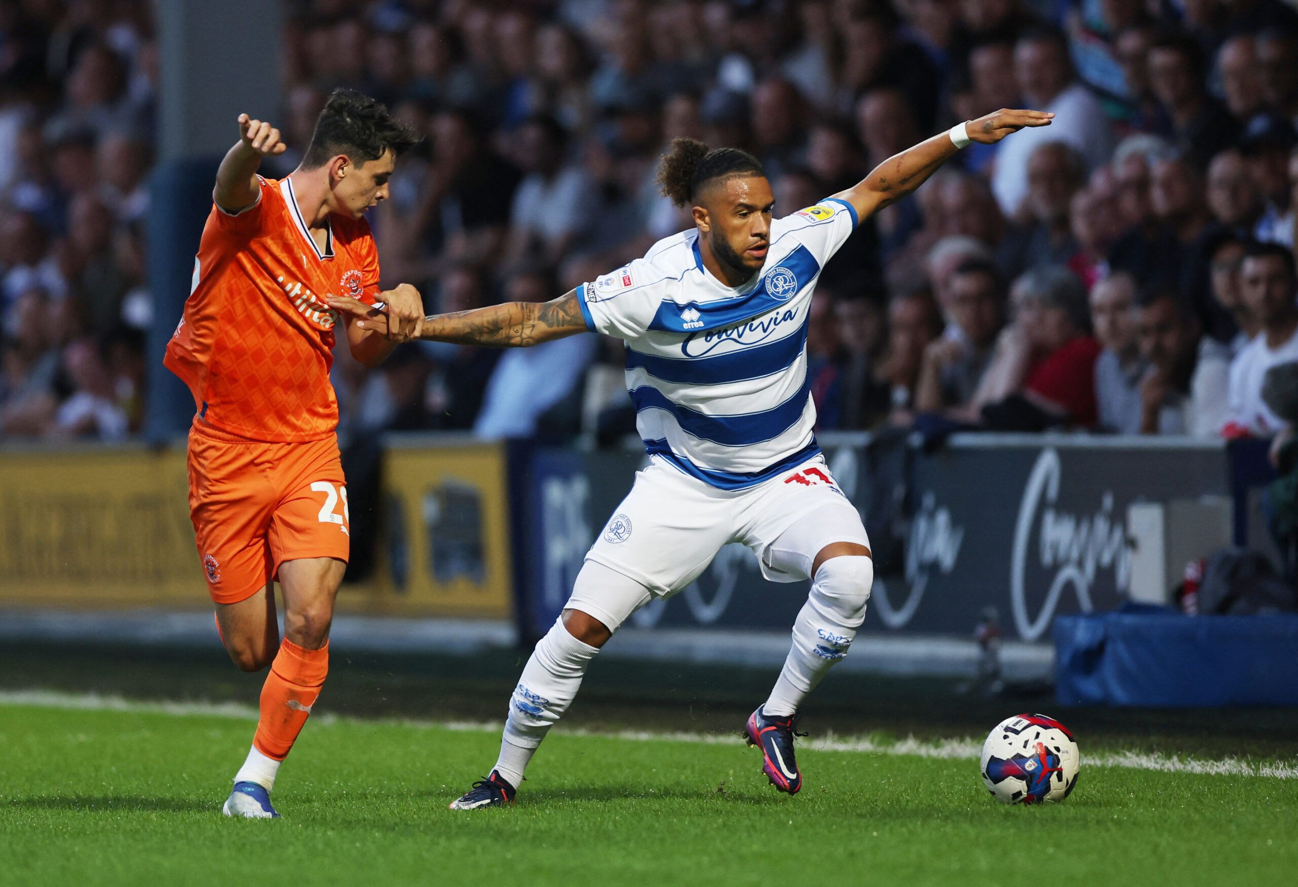 Soccer Football - Championship - Queens Park Rangers v Blackpool - Loftus Road, London, Britain - August 16, 2022 Queens Park Rangers' Tyler Roberts in action with Blackpool's Charlie Patino Action Images/Matthew Childs EDITORIAL USE ONLY. No use with unauthorized audio, video, data, fixture lists, club/league logos or 'live' services. Online in-match use limited to 75 images, no video emulation. No use in betting, games or single club /league/player publications.  Please contact your account re