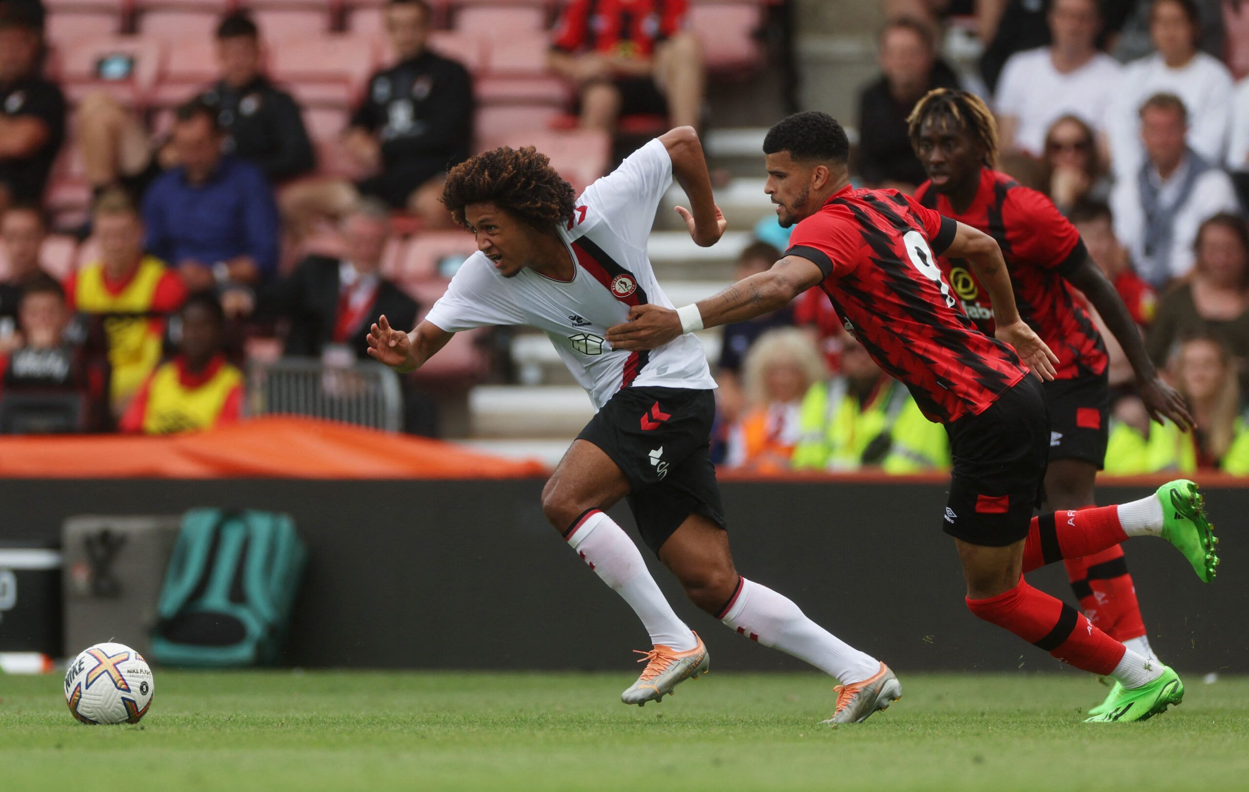 Soccer Football - Pre Season Friendly - AFC Bournemouth v Bristol City - Vitality Stadium, Bournemouth, Britain - July 23, 2022 AFC Bournemouth's Dominic Solanke in action with Bristol City's Han-Noah Massengo Action Images via Reuters/Paul Childs