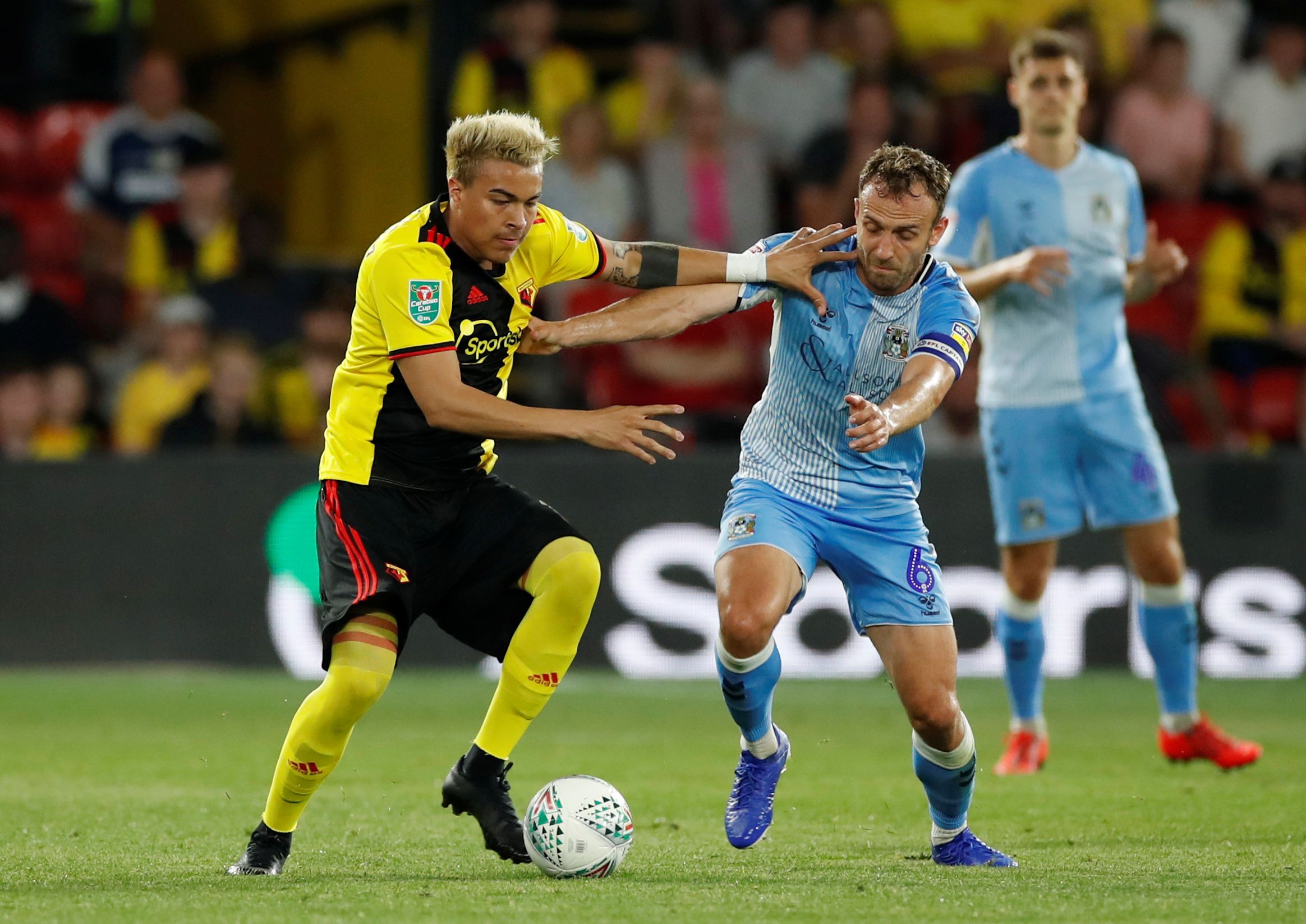 Soccer Football - Carabao Cup Second Round - Watford v Coventry City - Vicarage Road, Watford, Britain - August 27, 2019  Coventry City's Liam Kelly in action with Watford's Adalberto Penaranda   Action Images via Reuters/Paul Childs  EDITORIAL USE ONLY. No use with unauthorized audio, video, data, fixture lists, club/league logos or 