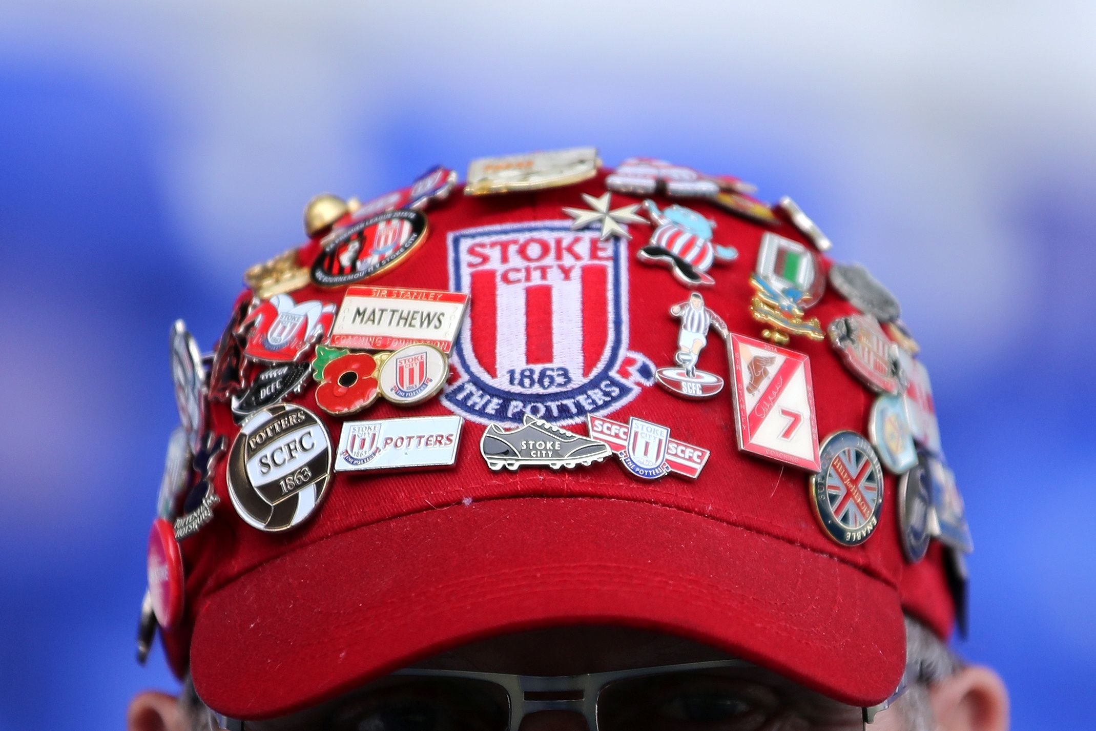 Soccer Football - Championship - Birmingham City v Stoke City - St Andrew's, Birmingham, Britain - August 31, 2019   General view of a Stoke City fans cap with badges before the match    Action Images/Molly Darlington    EDITORIAL USE ONLY. No use with unauthorized audio, video, data, fixture lists, club/league logos or 