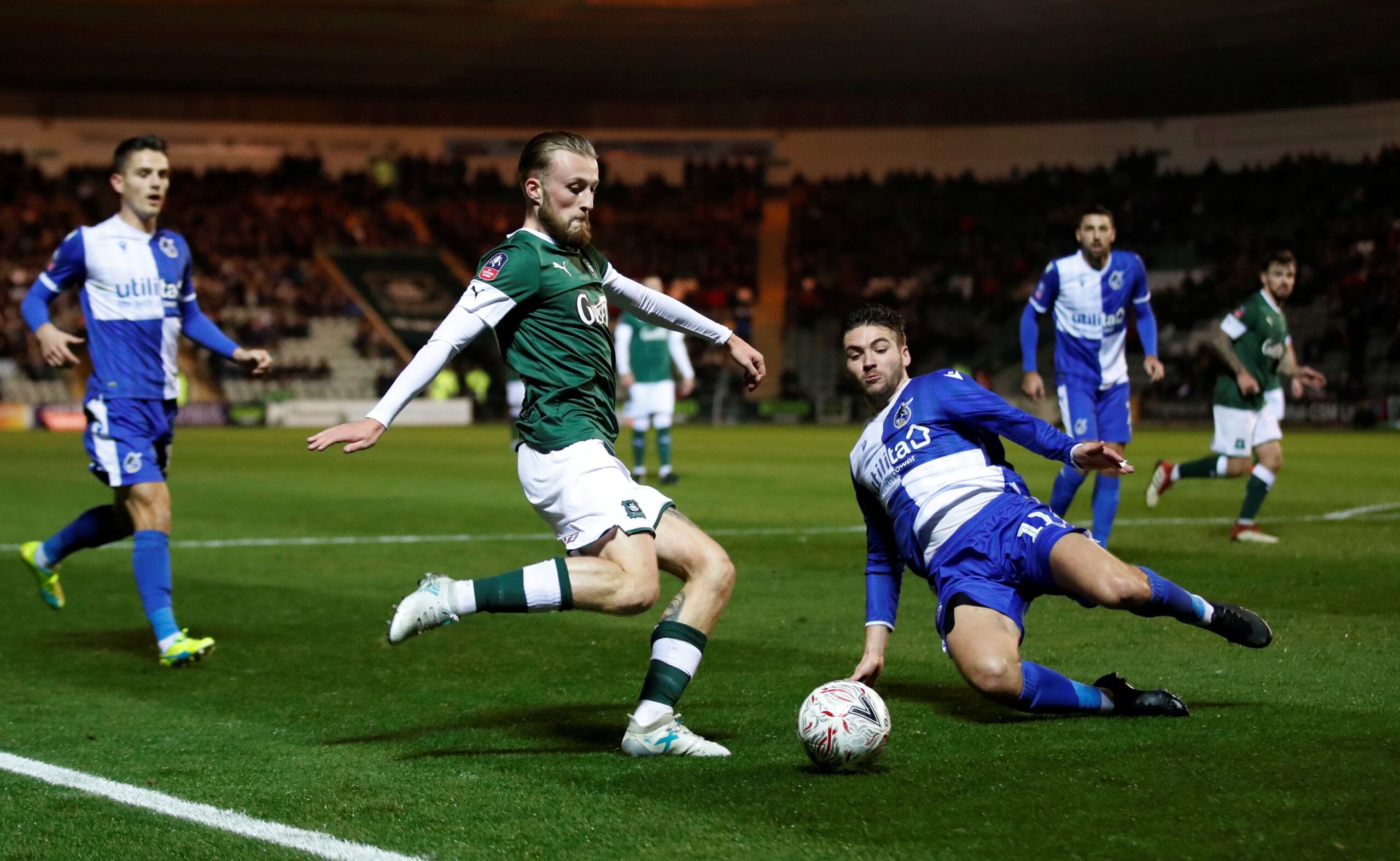 Soccer Football - FA Cup - Second Round Replay - Plymouth Argyle v Bristol Rovers - Home Park, Plymouth, Britain - December 17, 2019   Plymouth Argyle's George Cooper in action with Bristol Rovers' Luke Leahy   Action Images/Peter Cziborra