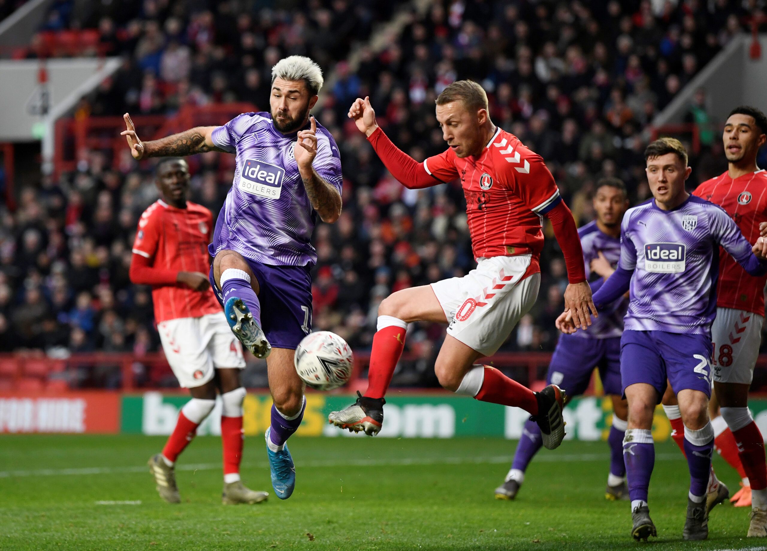 Soccer Football - FA Cup - Third Round - Charlton Athletic v West Bromwich Albion - The Valley, London, Britain - January 5, 2020  Charlton's Chris Solly in action with West Bromwich Albion's Charlie Austin  Action Images/Tony O'Brien