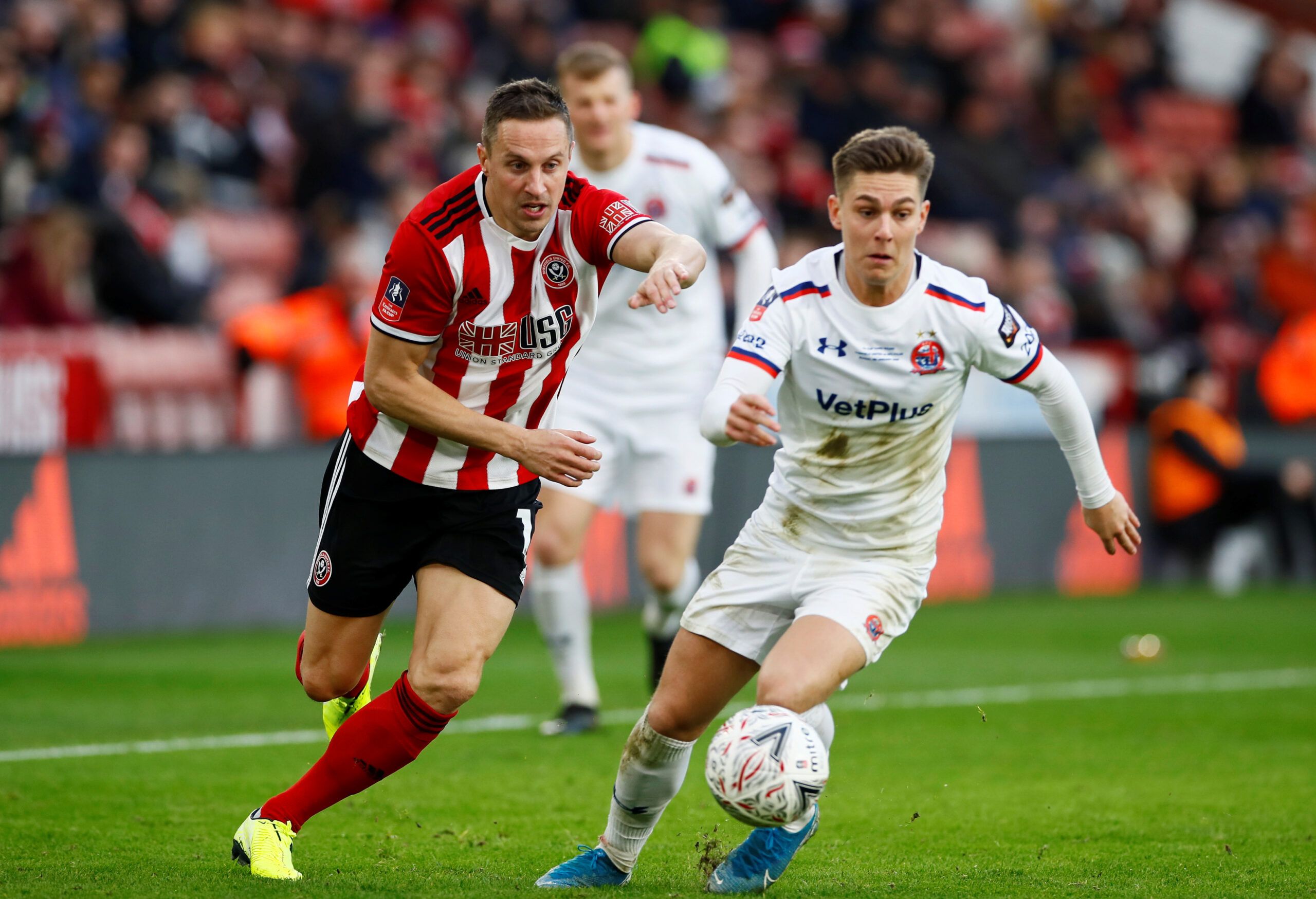 Soccer Football - FA Cup - Third Round - Sheffield United v AFC Fylde - Bramall Lane, Sheffield, Britain - January 5, 2020  Sheffield United's Phil Jagielka in action with AFC Fylde's Nick Haughton   Action Images via Reuters/Jason Cairnduff
