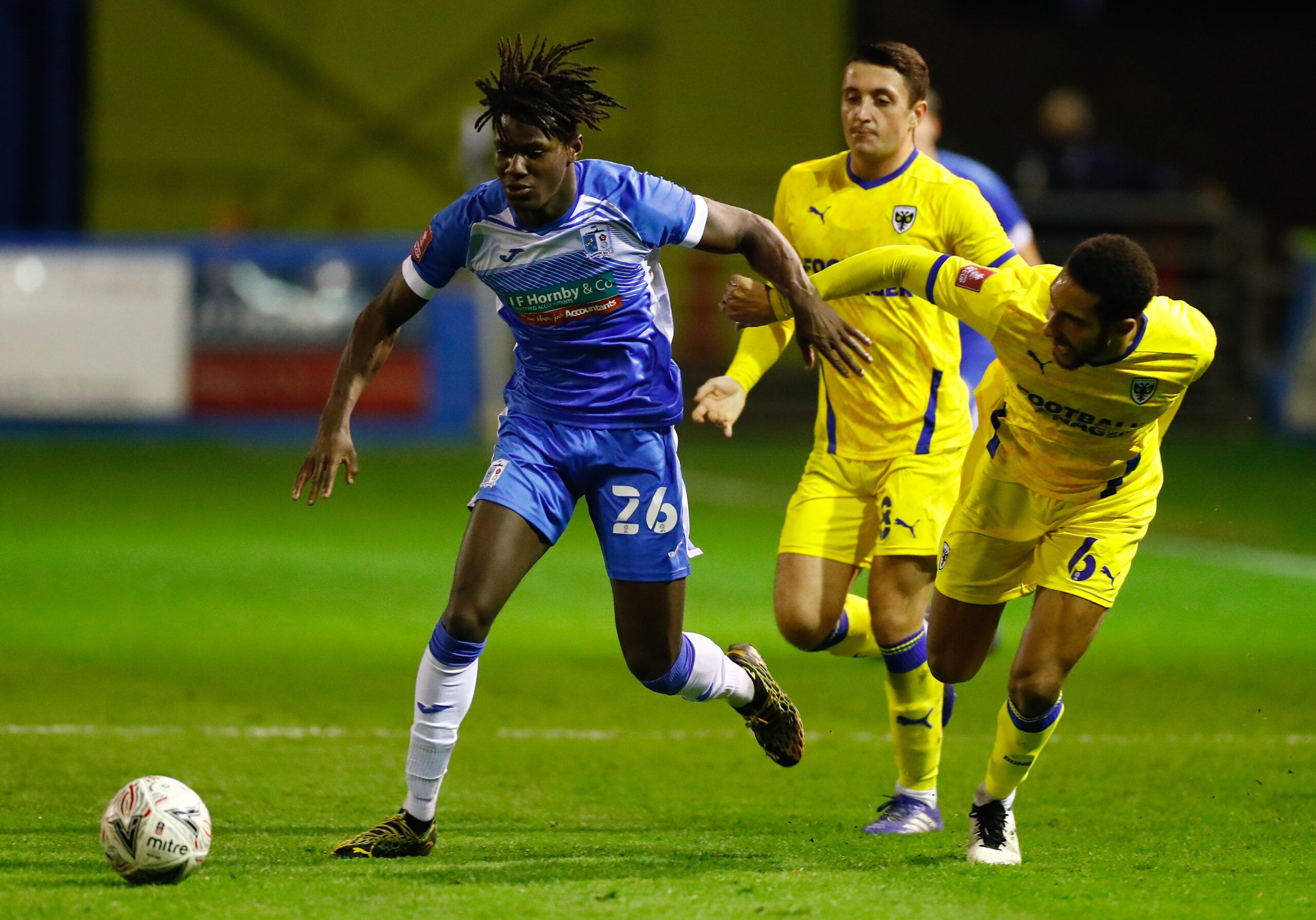 Soccer Football - FA Cup First Round - Barrow v AFC Wimbledon - Progression Solicitors Stadium, Barrow-In-Furness, Britain - November 26, 2020 Barrow's Dimitri Sea in action with AFC Wimbledon's Terrell Thomas Action Images/Jason Cairnduff