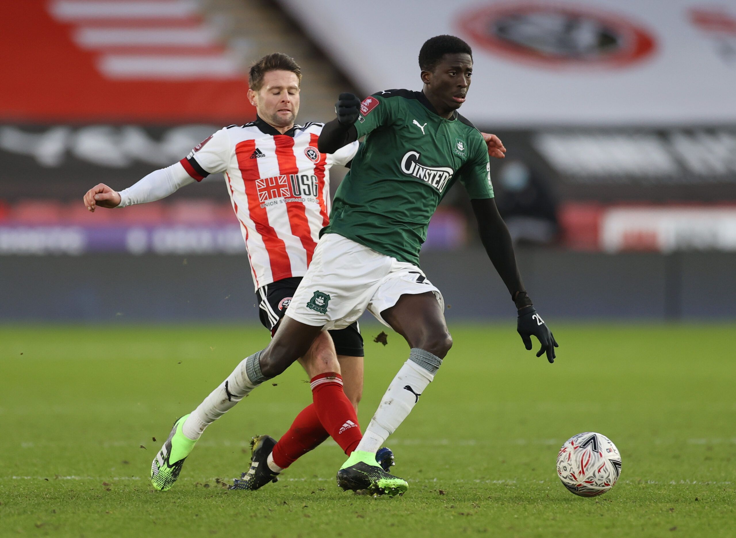 Soccer Football - FA Cup - Fourth Round - Sheffield United v Plymouth Argyle - Bramall Lane, Sheffield, Britain - January 23, 2021 Sheffield United's Oliver Norwood in action with Plymouth Argyle's Panutche Camara Action Images via Reuters/Lee Smith