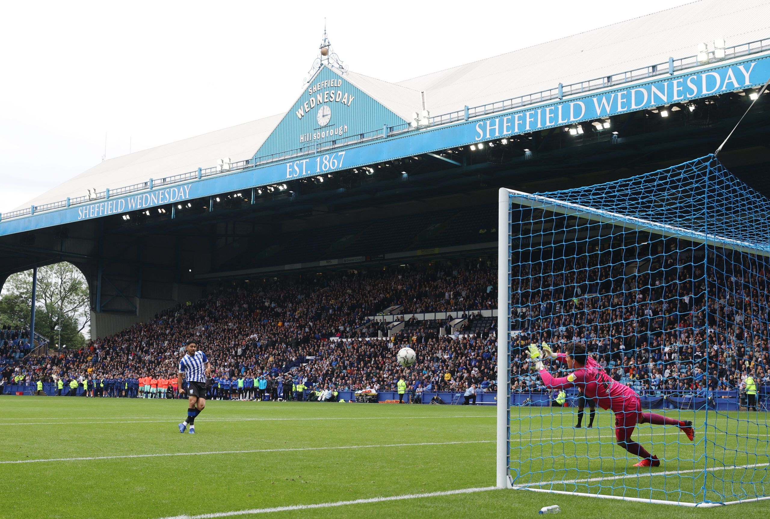 Soccer Football - Carabao Cup First Round - Sheffield Wednesday v Huddersfield Town - Hillsborough, Sheffield, Britain - August 1, 2021 Huddersfield Town's Lee Nicholls saves a penalty from Sheffield Wednesday's Massimo Luongo during the shootout Action Images/Lee Smith