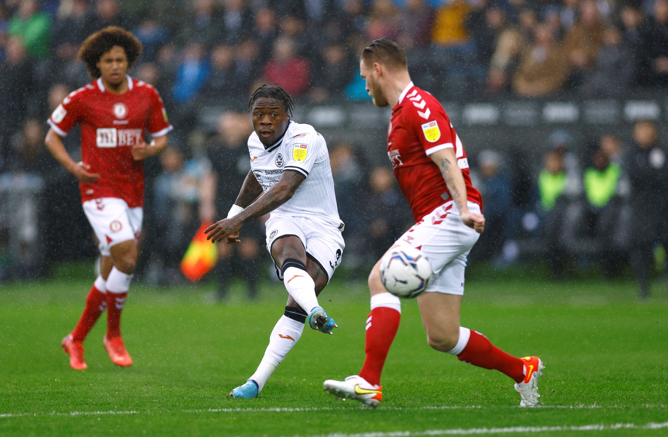 Soccer Football - Championship - Swansea City v Bristol City - Swansea.com Stadium, Swansea, Britain - February 13, 2022 Swansea City's Michael Obafemi shoots at goal     Action Images/Andrew Boyers  EDITORIAL USE ONLY. No use with unauthorized audio, video, data, fixture lists, club/league logos or 