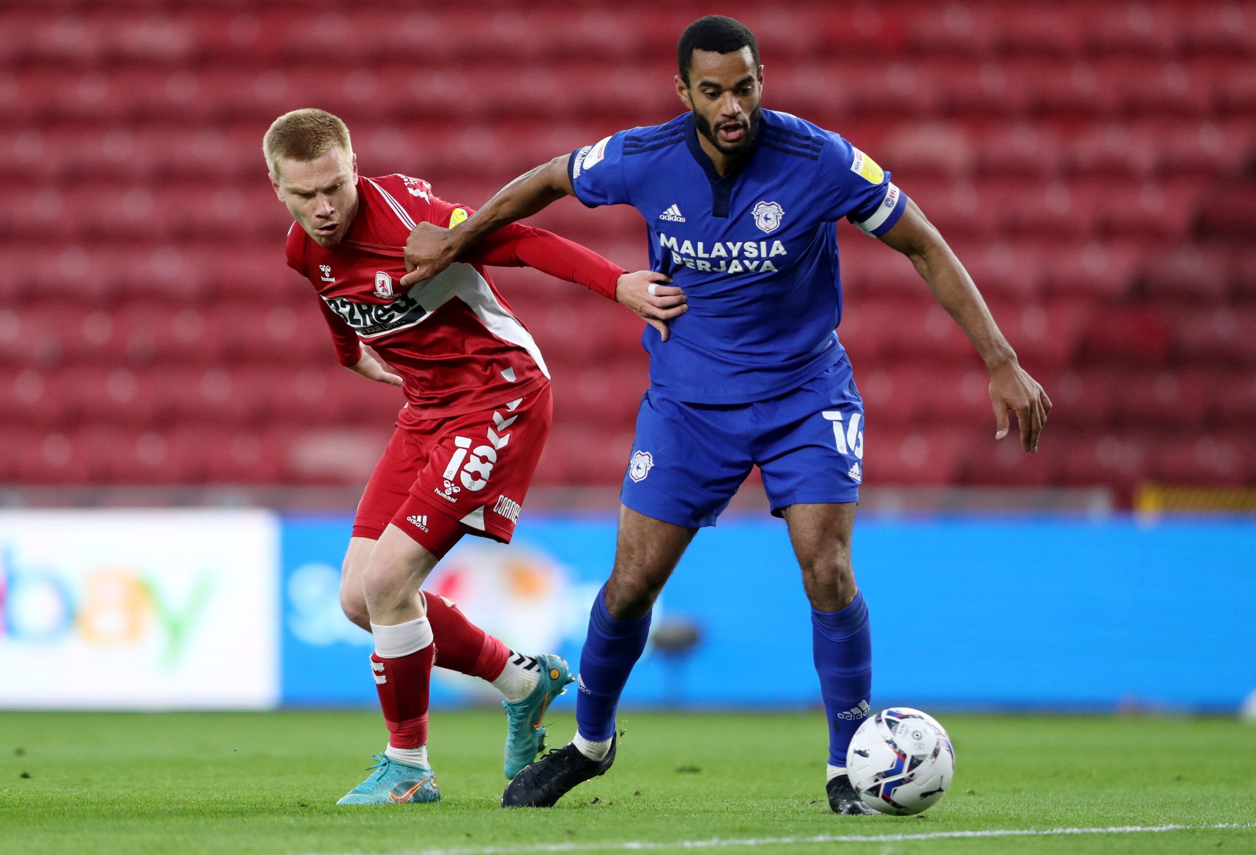 Soccer Football - Championship - Middlesbrough v Cardiff City - Riverside Stadium, Middlesbrough, Britain - April 27, 2022  Middlesbrough's Duncan Watmore in action with Cardiff City's Curtis Nelson    Action Images/Molly Darlington    EDITORIAL USE ONLY. No use with unauthorized audio, video, data, fixture lists, club/league logos or 