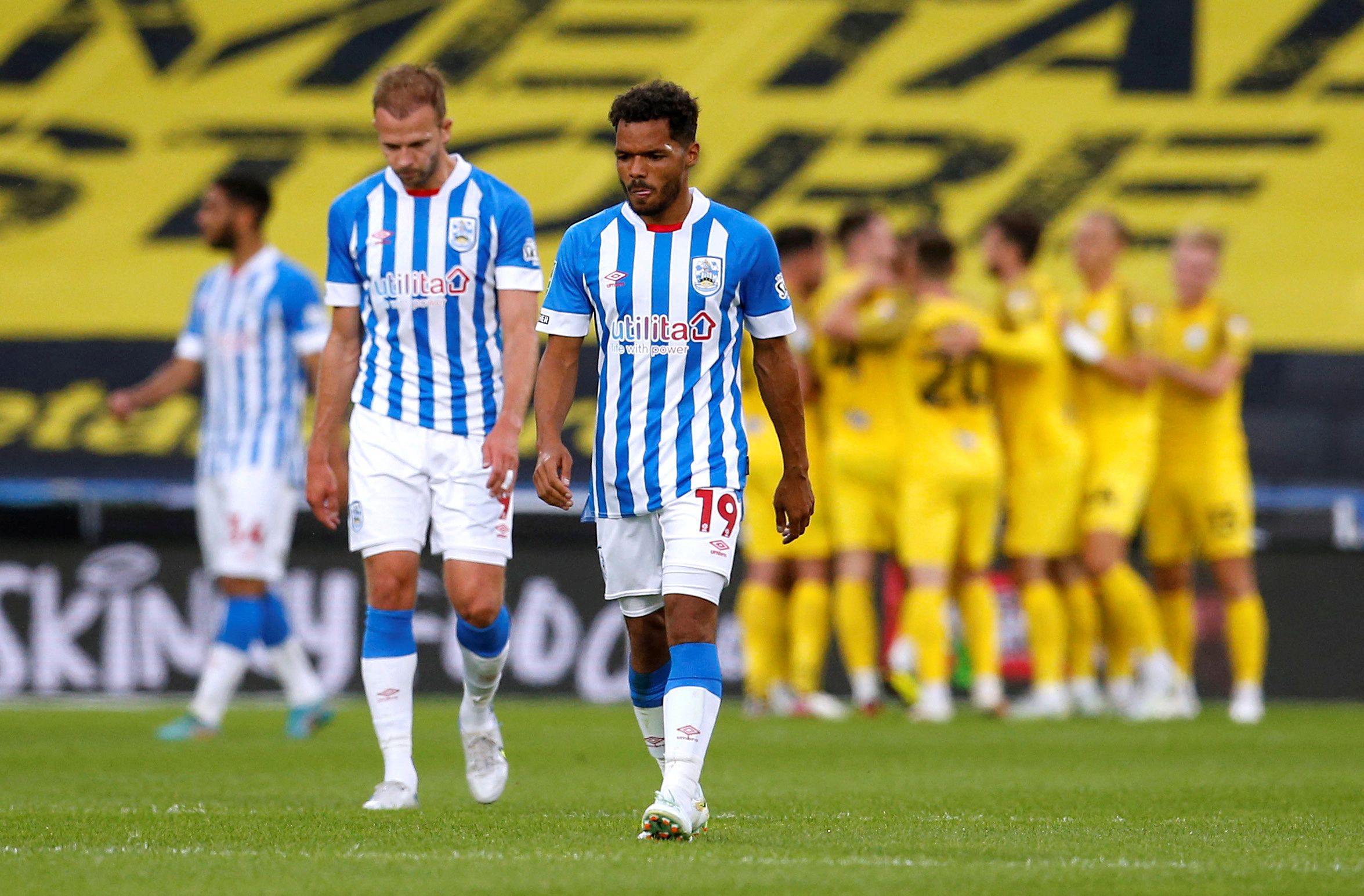 Soccer Football - Carabao Cup - Huddersfield Town v Preston North End - John Smith's Stadium, Huddersfield, Britain - August 9, 2022 Huddersfield Town's Duane Holmes and Jordan Rhodes look dejected after Preston North End scores their third goal Action Images/Ed Sykes  EDITORIAL USE ONLY. No use with unauthorized audio, video, data, fixture lists, club/league logos or "live" services. Online in-match use limited to 75 images, no video emulation. No use in betting, games or single club/league/pla