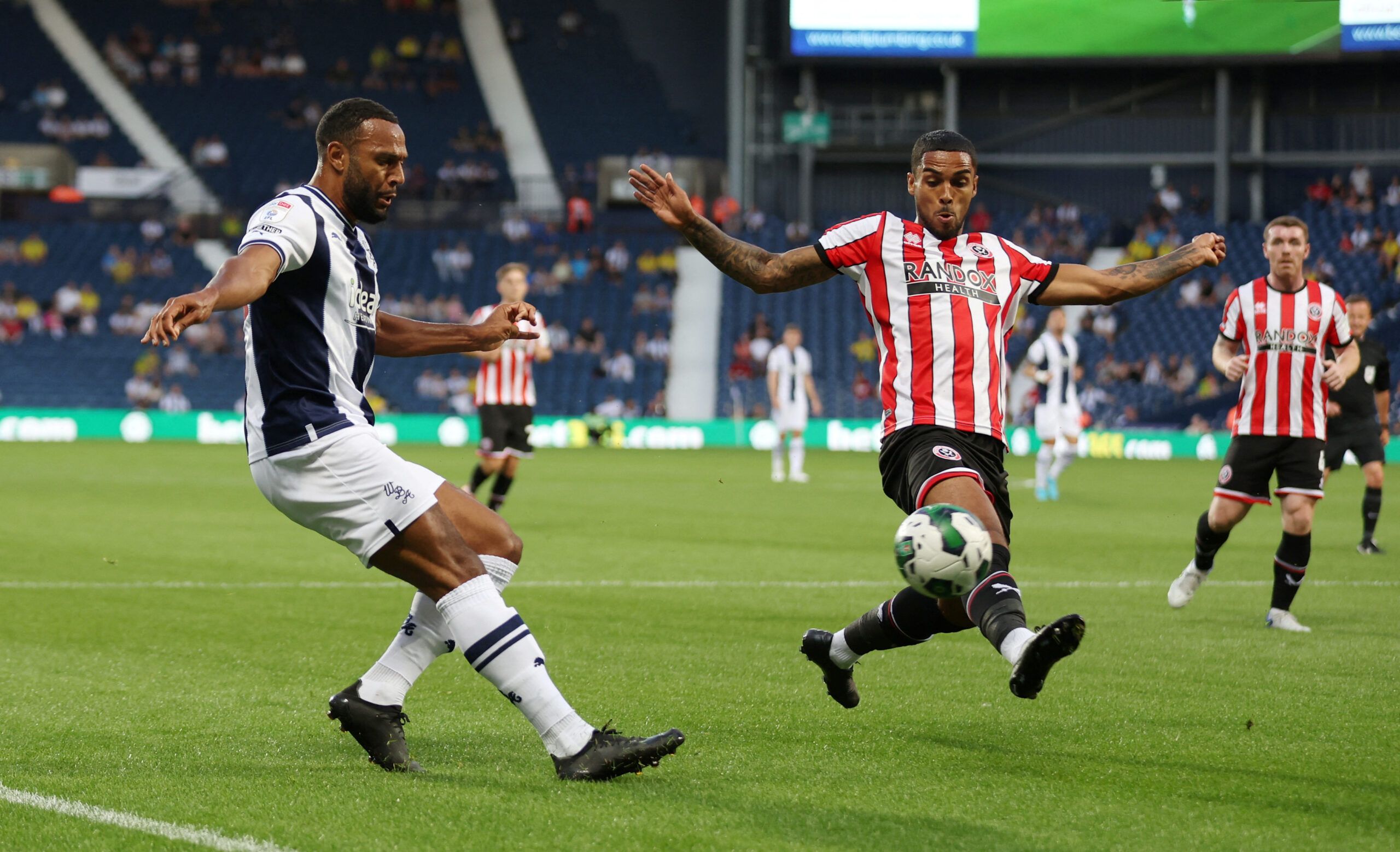 Soccer Football - Carabao Cup - West Bromwich Albion v Sheffield United - The Hawthorns, West Bromwich, Britain - August 11, 2022 West Bromwich Albion's Matt Phillips in action with Sheffield United's Max Lowe Action Images/Matthew Childs  EDITORIAL USE ONLY. No use with unauthorized audio, video, data, fixture lists, club/league logos or 