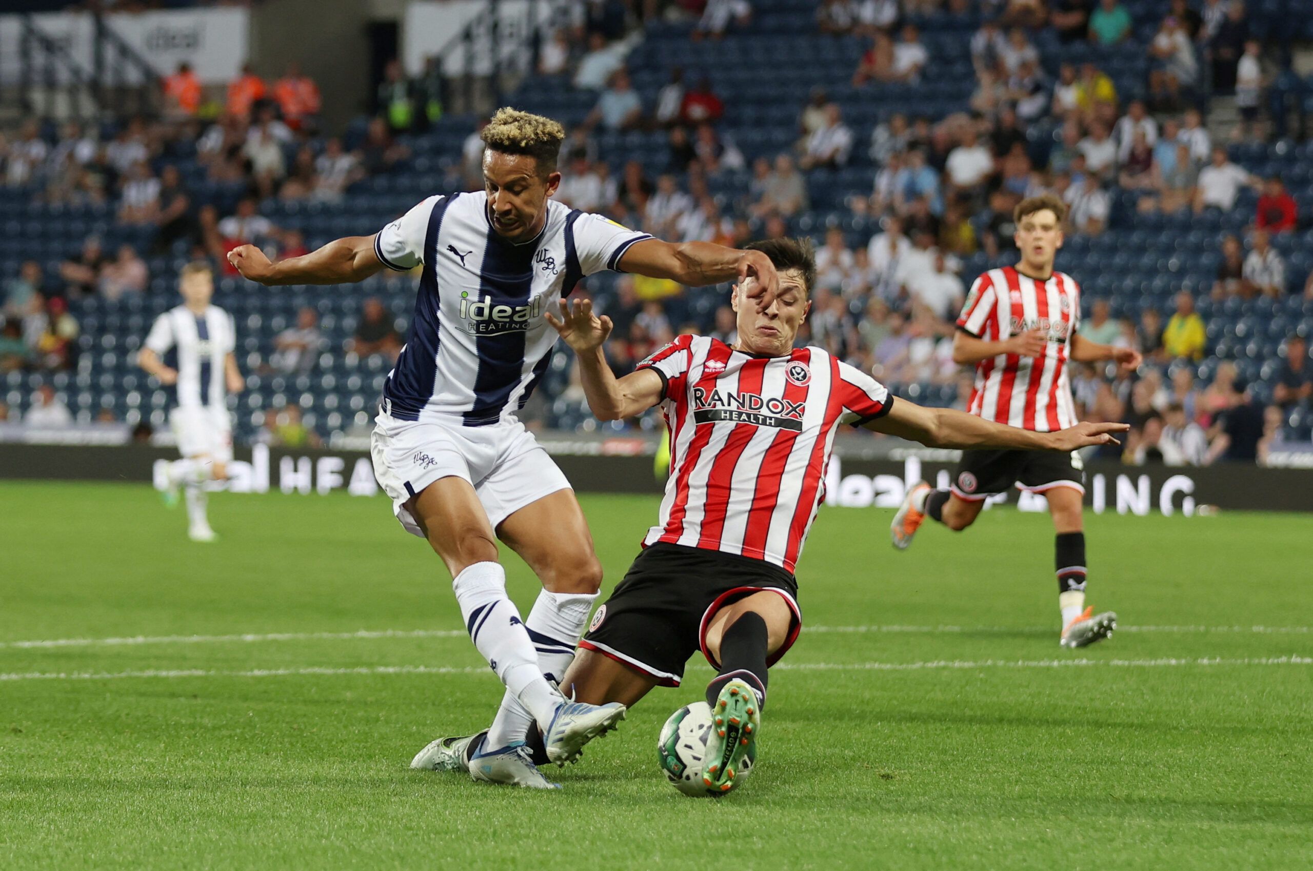 Soccer Football - Carabao Cup - West Bromwich Albion v Sheffield United - The Hawthorns, West Bromwich, Britain - August 11, 2022 West Bromwich Albion's Callum Robinson in action with Sheffield United's Anel Ahmedhodzic Action Images/Matthew Childs  EDITORIAL USE ONLY. No use with unauthorized audio, video, data, fixture lists, club/league logos or 