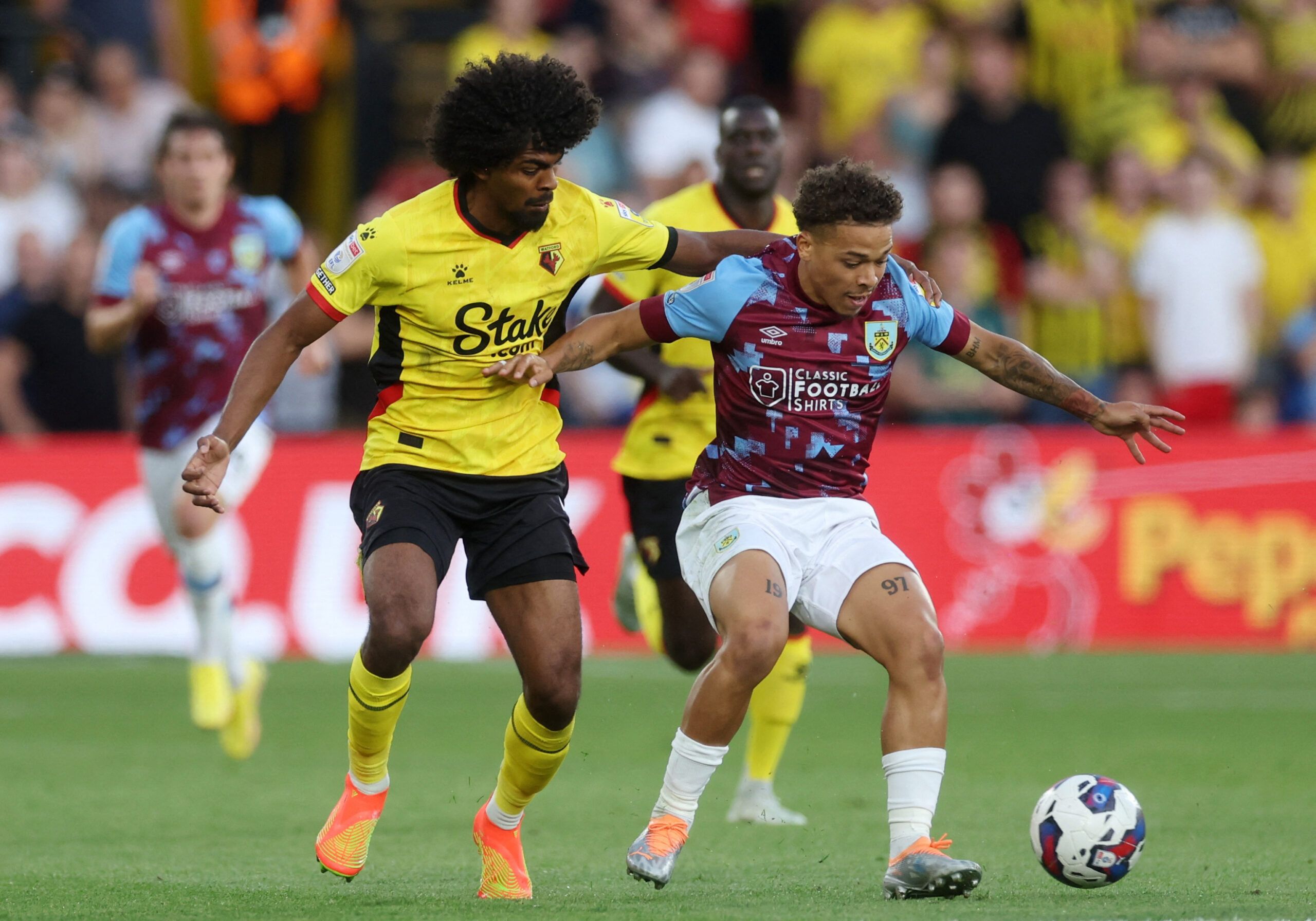 Soccer Football - Championship - Watford v Burnley - Vicarage Road, Watford, Britain - August 12, 2022 Watford's Hamza Choudhury in action with Burnley's Manuel Benson  EDITORIAL USE ONLY. No use with unauthorized audio, video, data, fixture lists, club/league logos or 