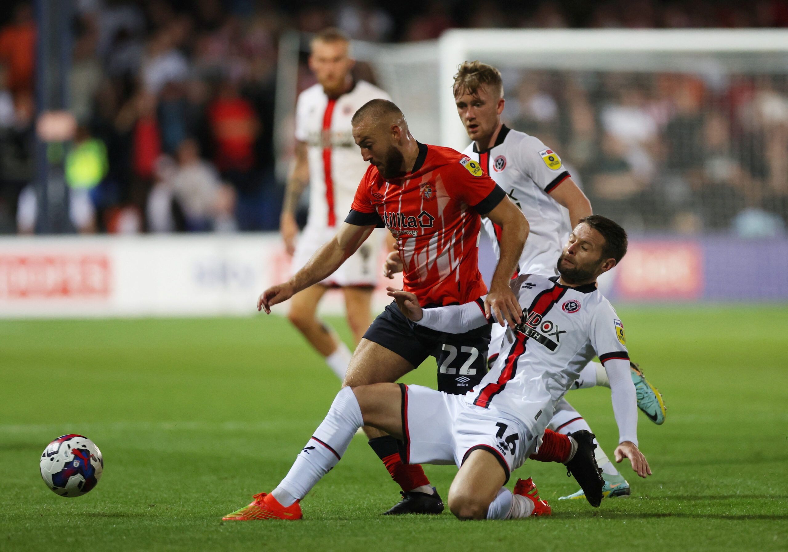 Soccer Football - Championship - Luton Town v Sheffield United - Kenilworth Road, Luton, Britain - August 26, 2022 Luton Town's Allan Campbell in action with Sheffield United's Oliver Norwood  Action Images/Matthew Childs  EDITORIAL USE ONLY. No use with unauthorized audio, video, data, fixture lists, club/league logos or 