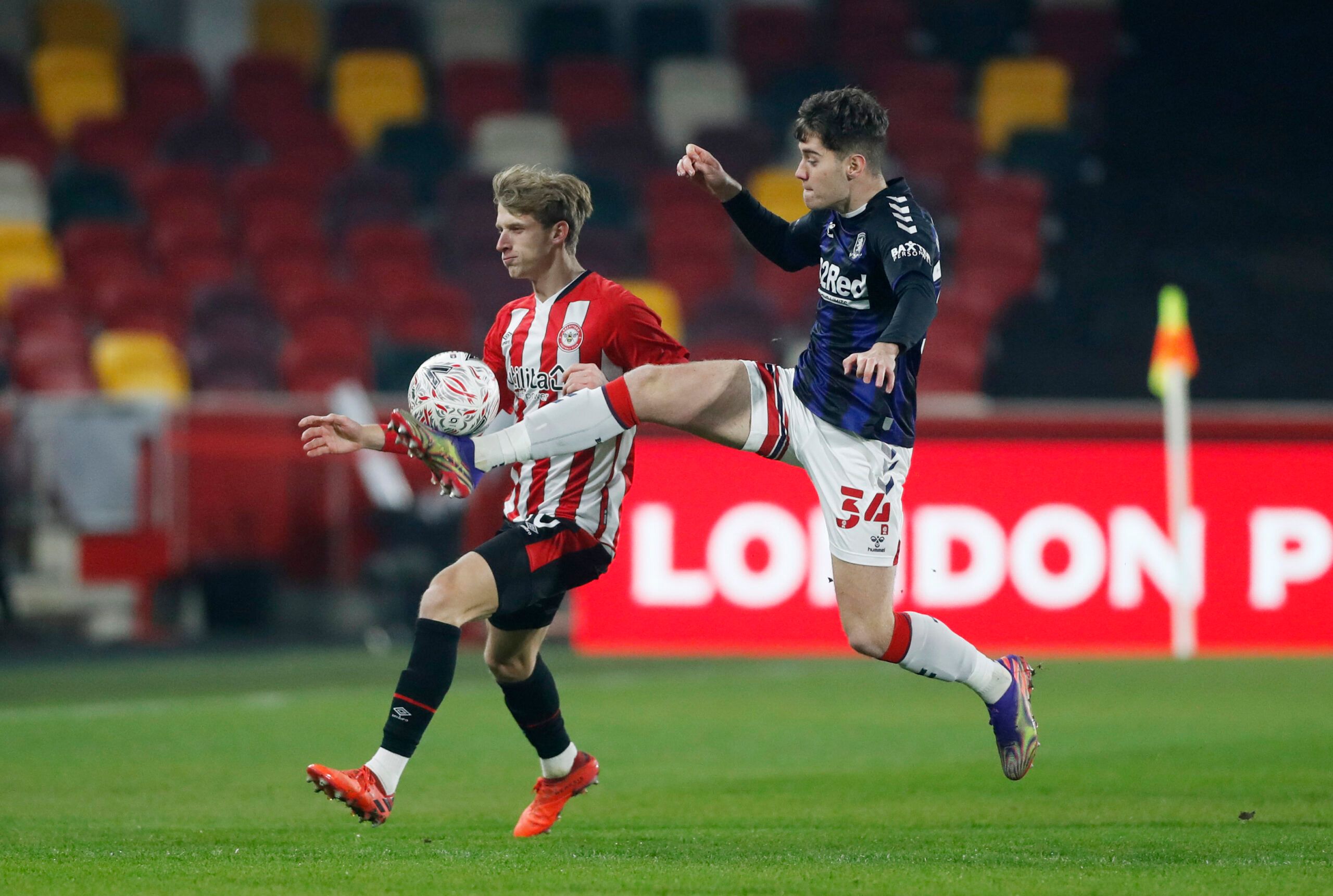 Soccer Football - FA Cup - Third Round - Brentford v Middlesbrough - Brentford Community Stadium, London, Britain - January 9, 2021  Brentford's Mads Roerslev in action with Middlesbrough's Hayden Hackney Action Images via Reuters/Matthew Childs
